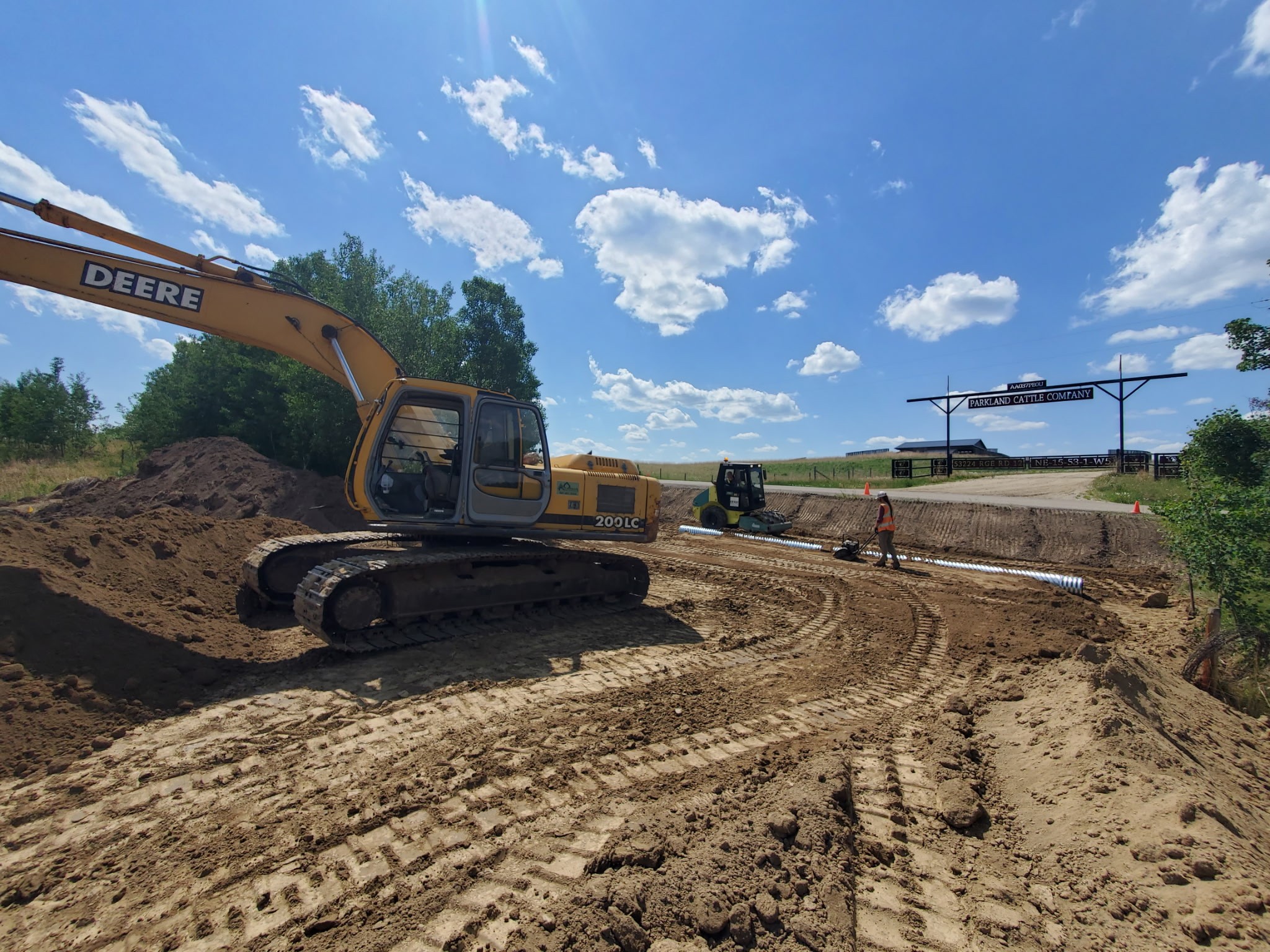 Skid Steer and a mini excavator clearing a site