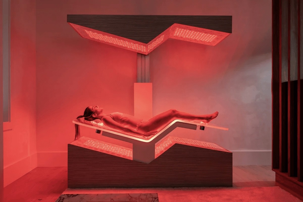 woman in white tank top and white shorts lying on black floor