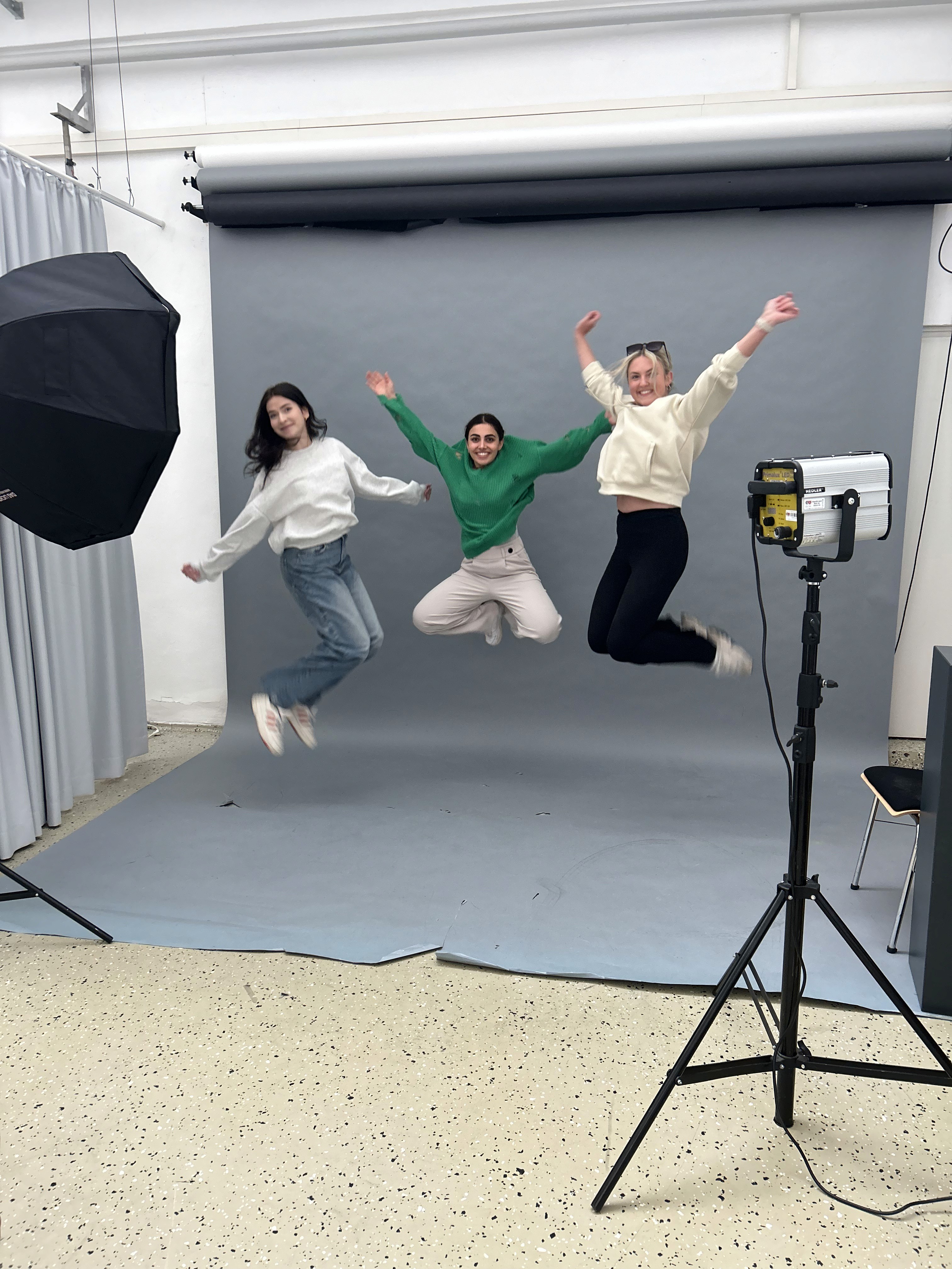 Person sitting on a ledge overlooking New York City skyline