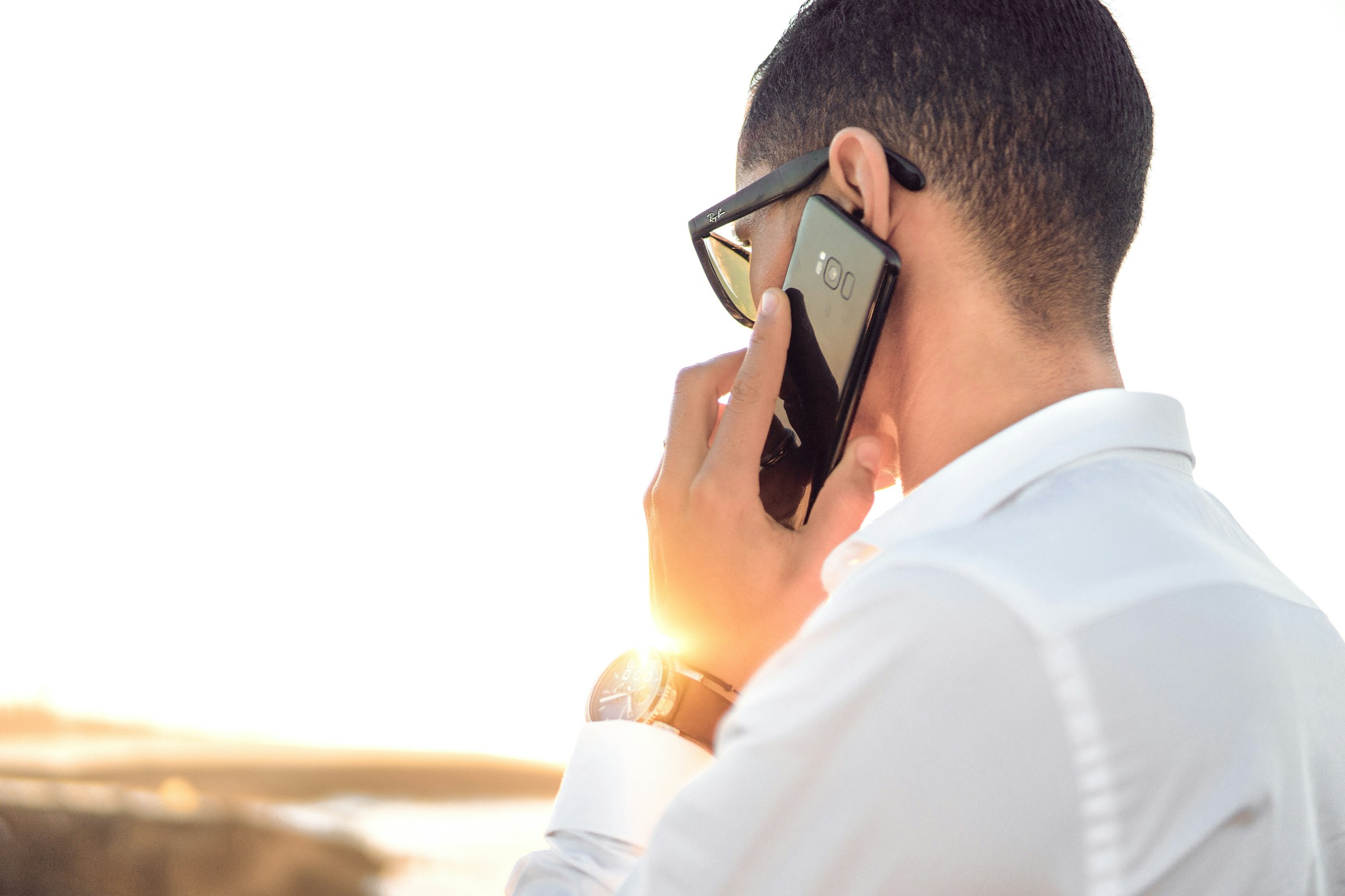 man on phone call - How to Make Automated Calls