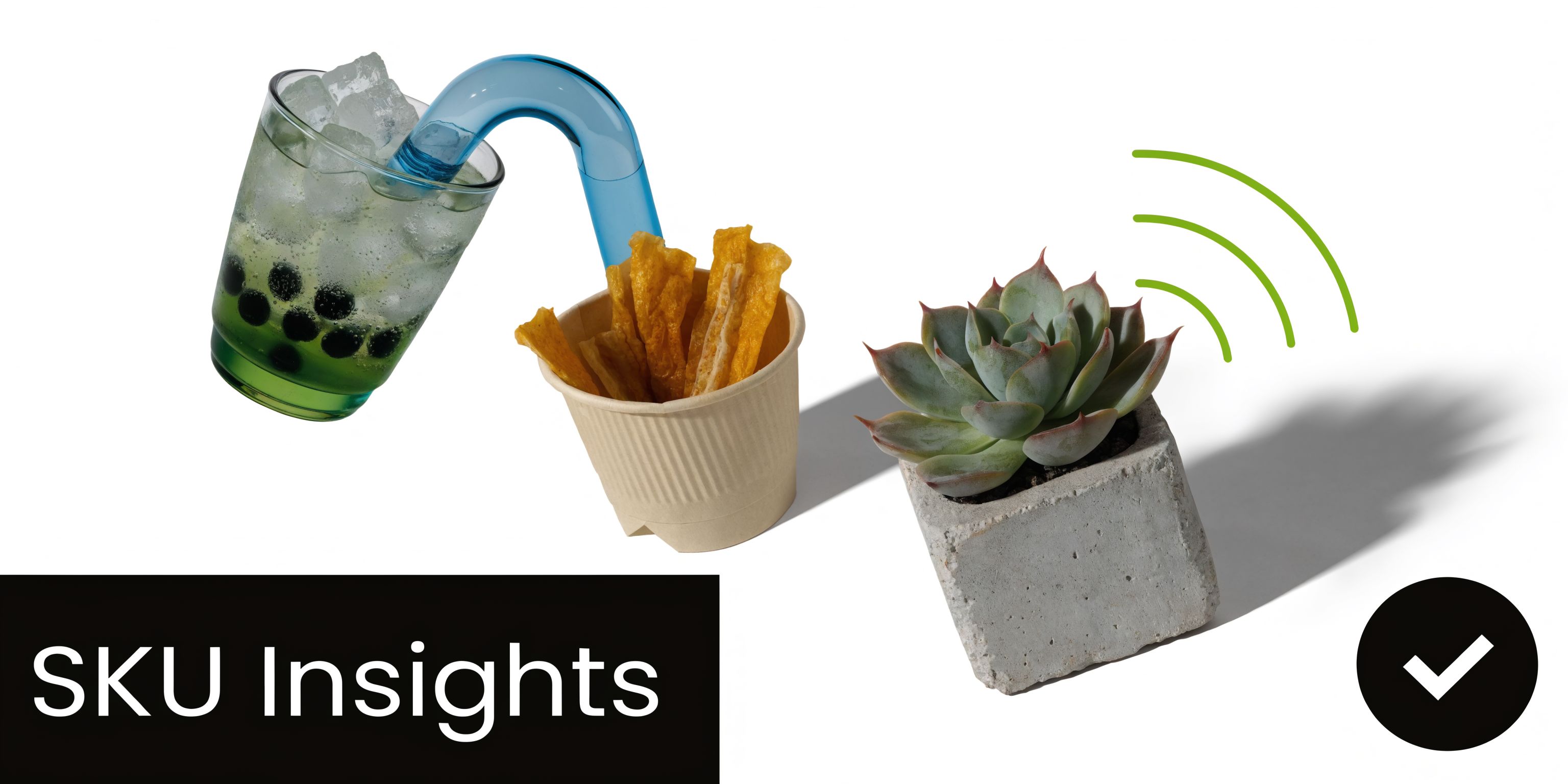 A creative arrangement featuring a boba tea, a bowl of snacks, and a small succulent plant.