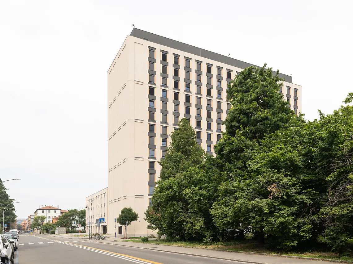 Exterior of the modern student accommodation building in Bologna