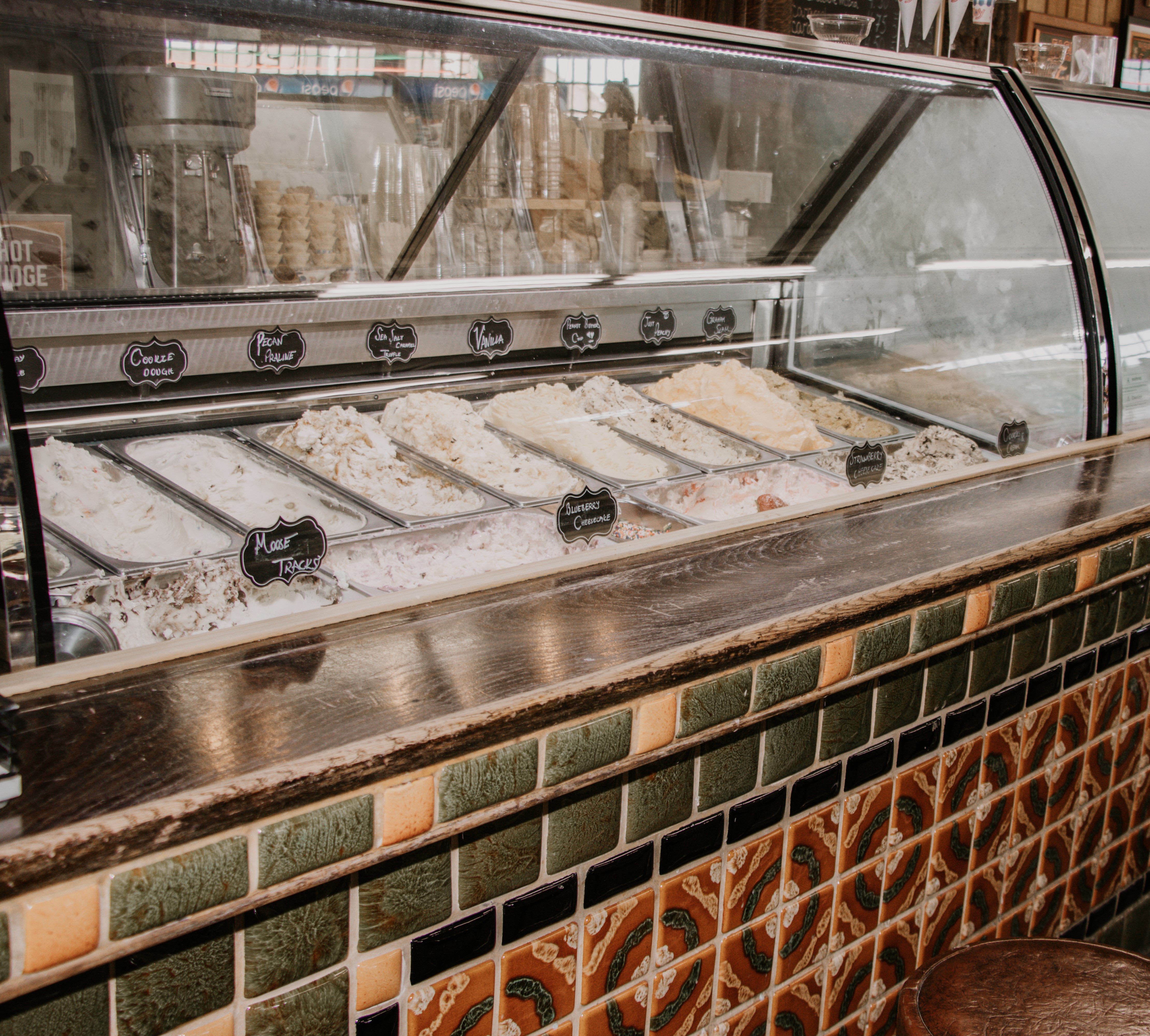 lake landscape with clear blue water, forest and mountains at the backdrop