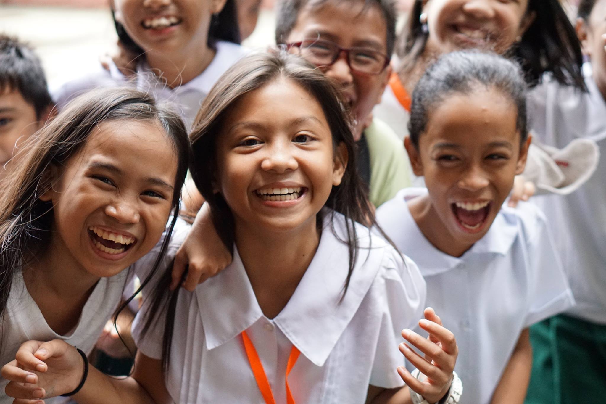 school in the philippines smiling for a picture