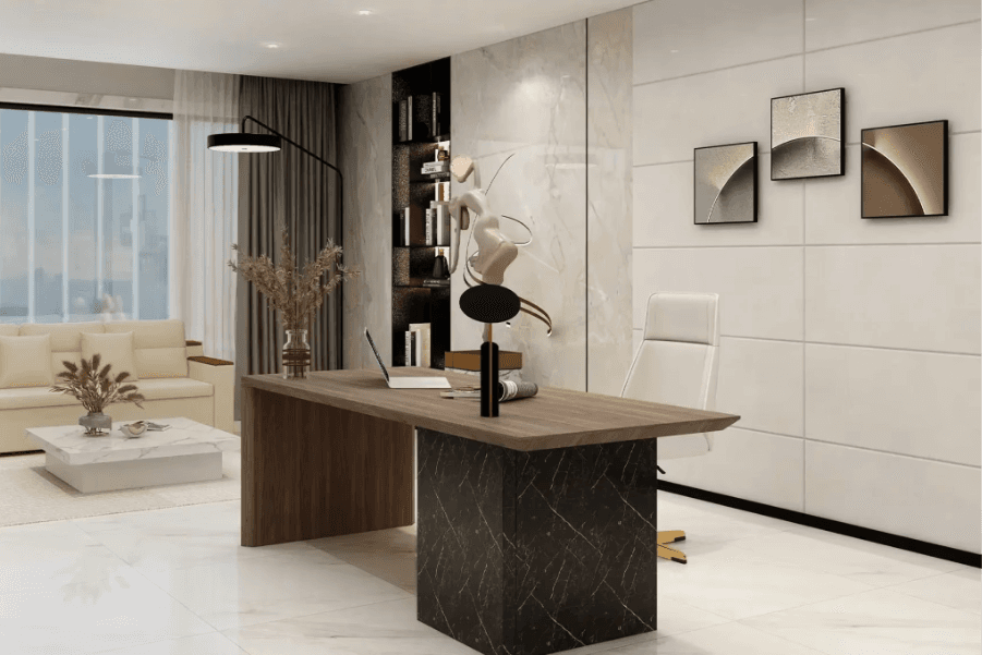 Modern office space with a marble desk, abstract art on the walls, a white leather chair, and a cozy sitting area