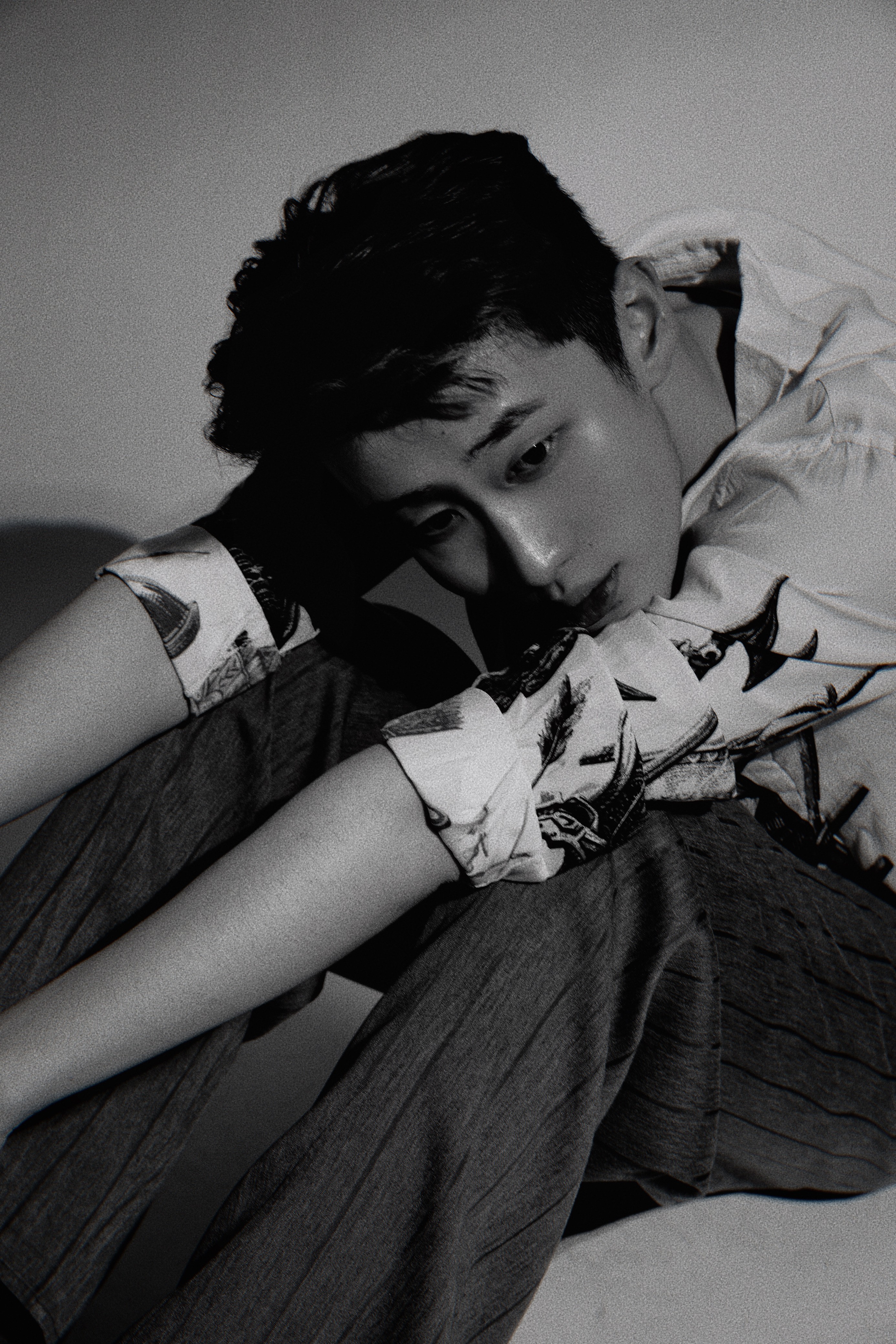 Kneeling man in studio