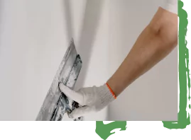 Painter painting a wall