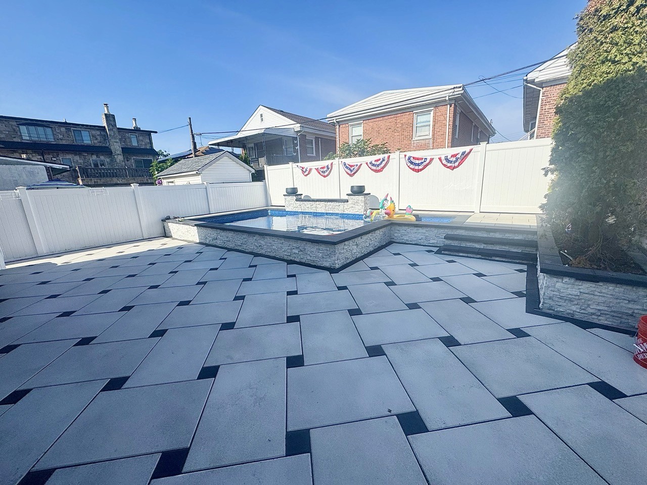 Paver pool patio and in-ground pool by CMC Masonry on Long Island