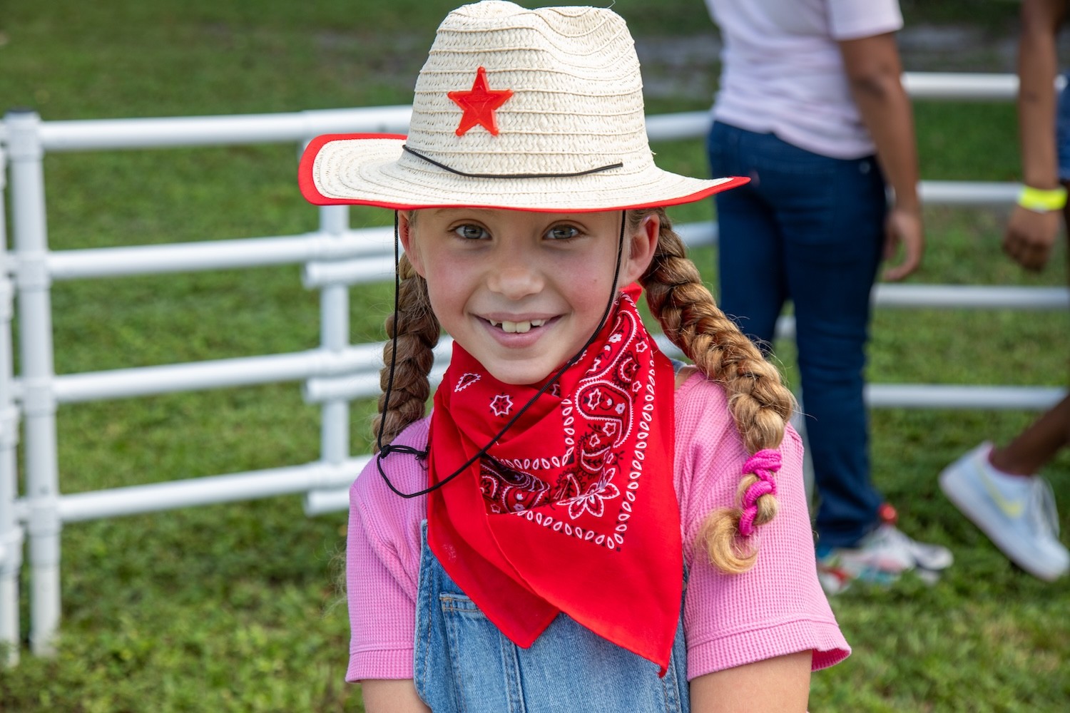 Young girl in western attire at a Tomorrow's Rainbow event