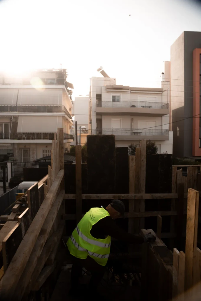 Building rising floor by floor behind formwork, photographed by TERAMOK