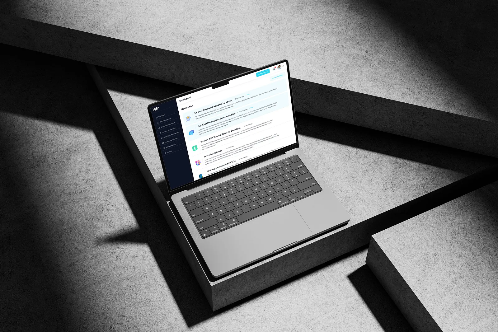 a laptop on a grey minimalist floor