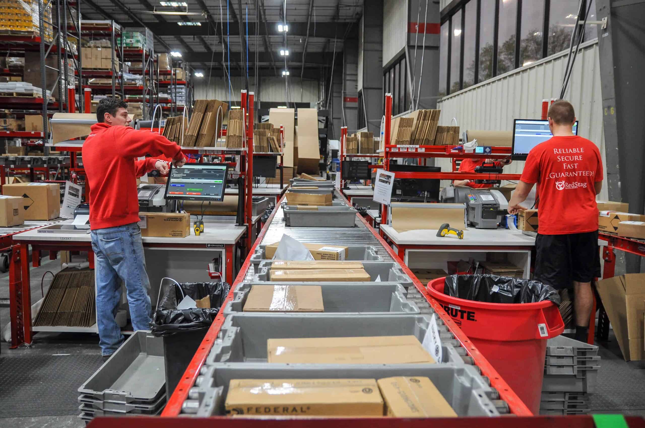 red stag fulfillment warehouse workers packing orders
