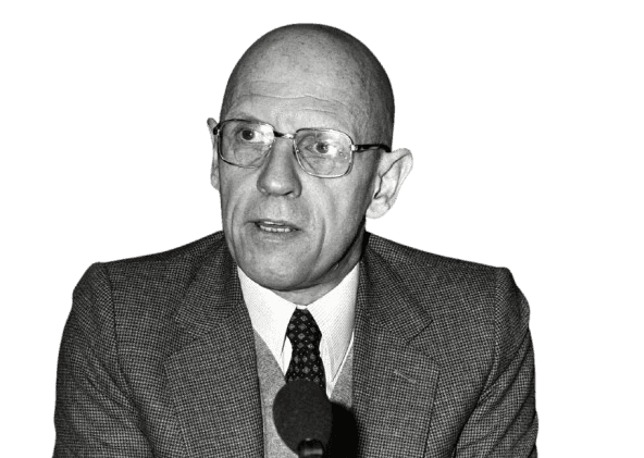 A black-and-white photograph of Michel Foucault, the influential French philosopher and social theorist. Wearing glasses and a formal suit, Foucault is seen speaking into a microphone, reflecting his role as a public intellectual. Known for his critical studies of power, knowledge, and institutions, Foucault's works, such as "Discipline and Punish" and "The History of Sexuality," reshaped the fields of philosophy, sociology, and political theory. This image captures his intellectual rigor and his impact on contemporary thought, particularly his analysis of societal structures and power dynamics.