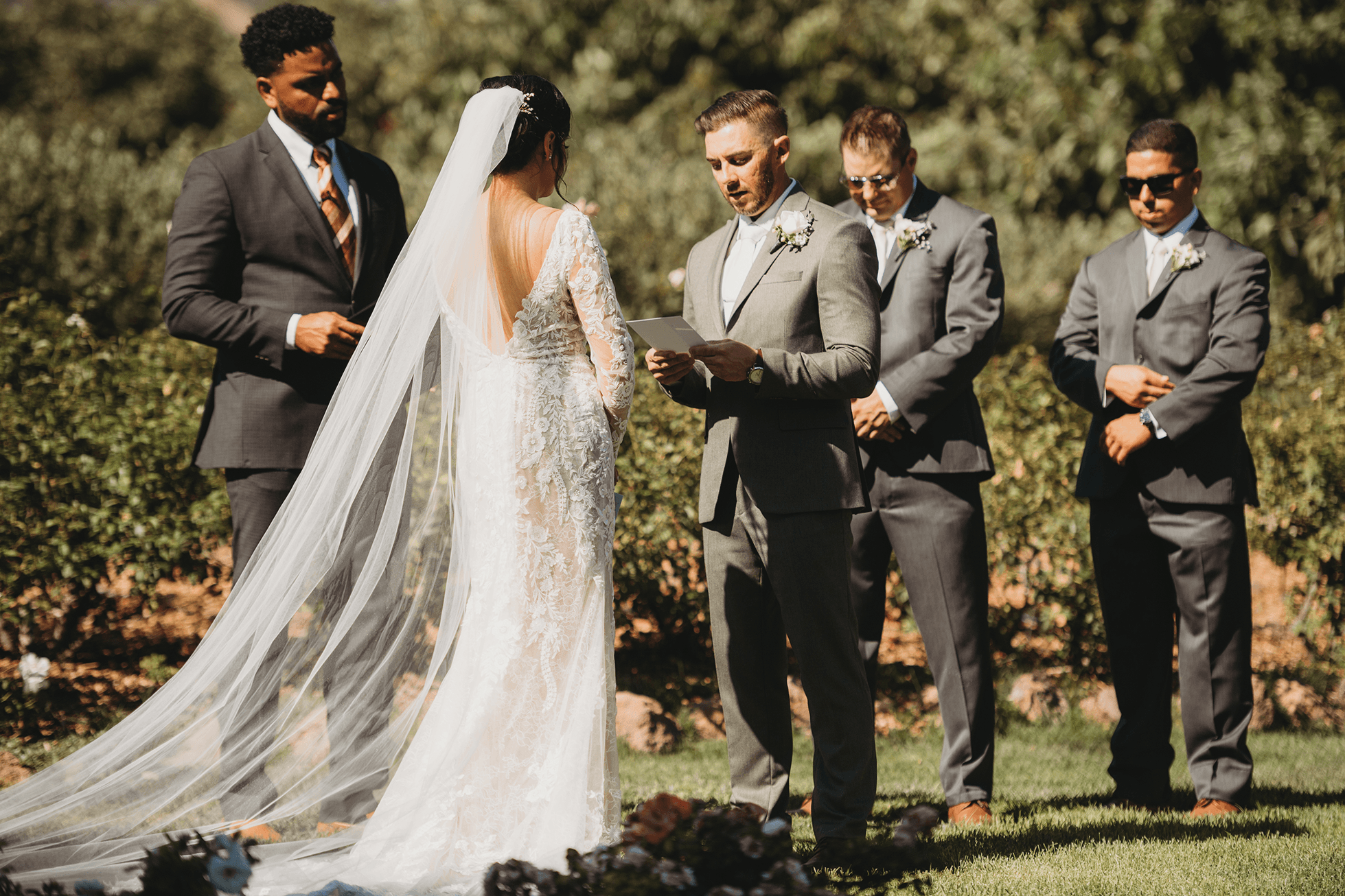 Flat lay wedding details with bouquet, rings, and sparkling bridal heels