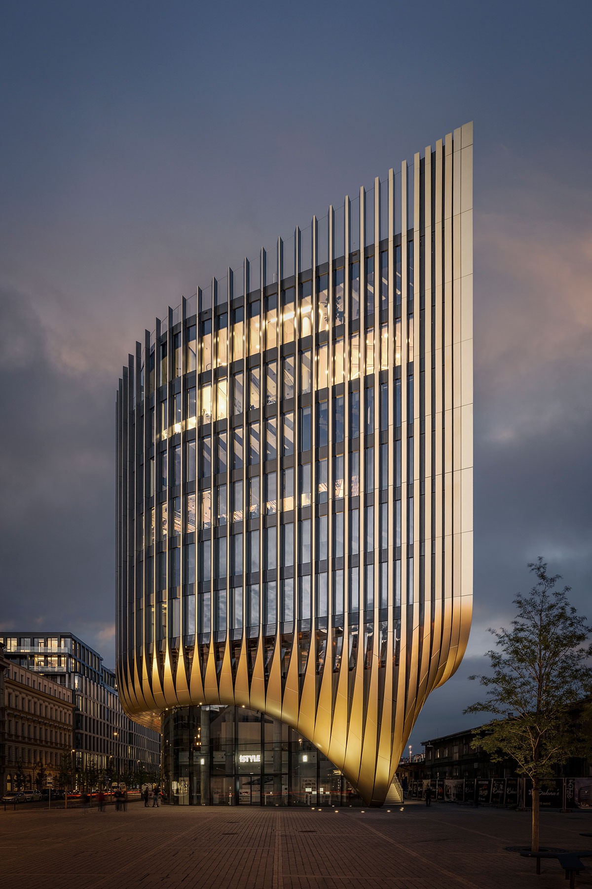 Modern architectural building photographed at dusk, showcasing contemporary facade design.