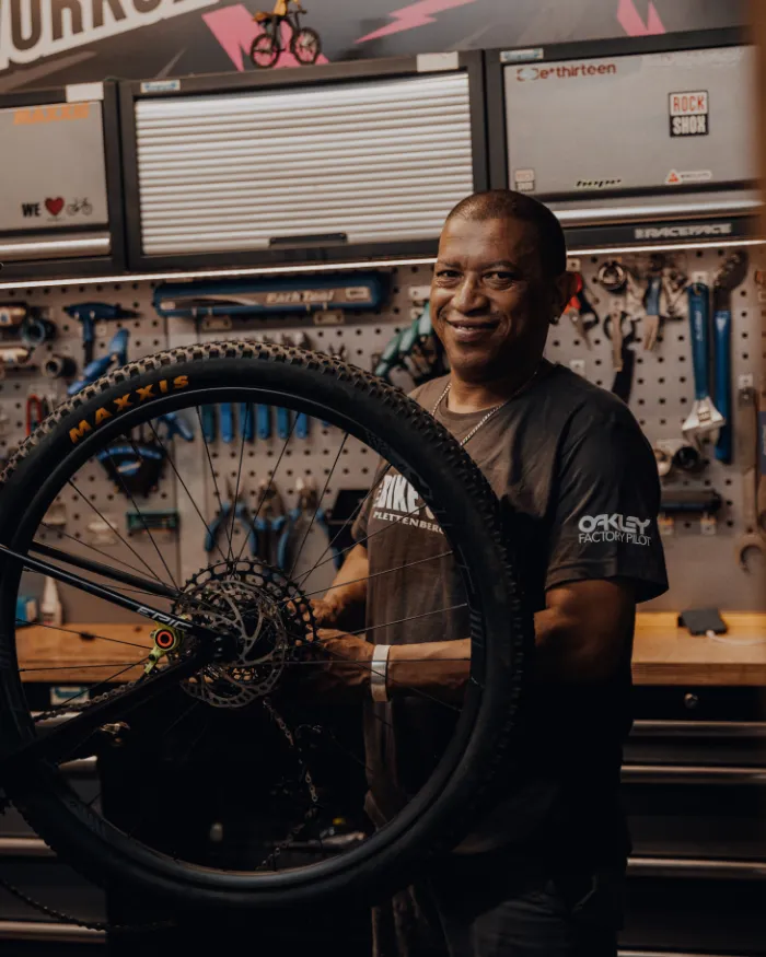 Grant the BIke Shop mechanic fixing a biycle