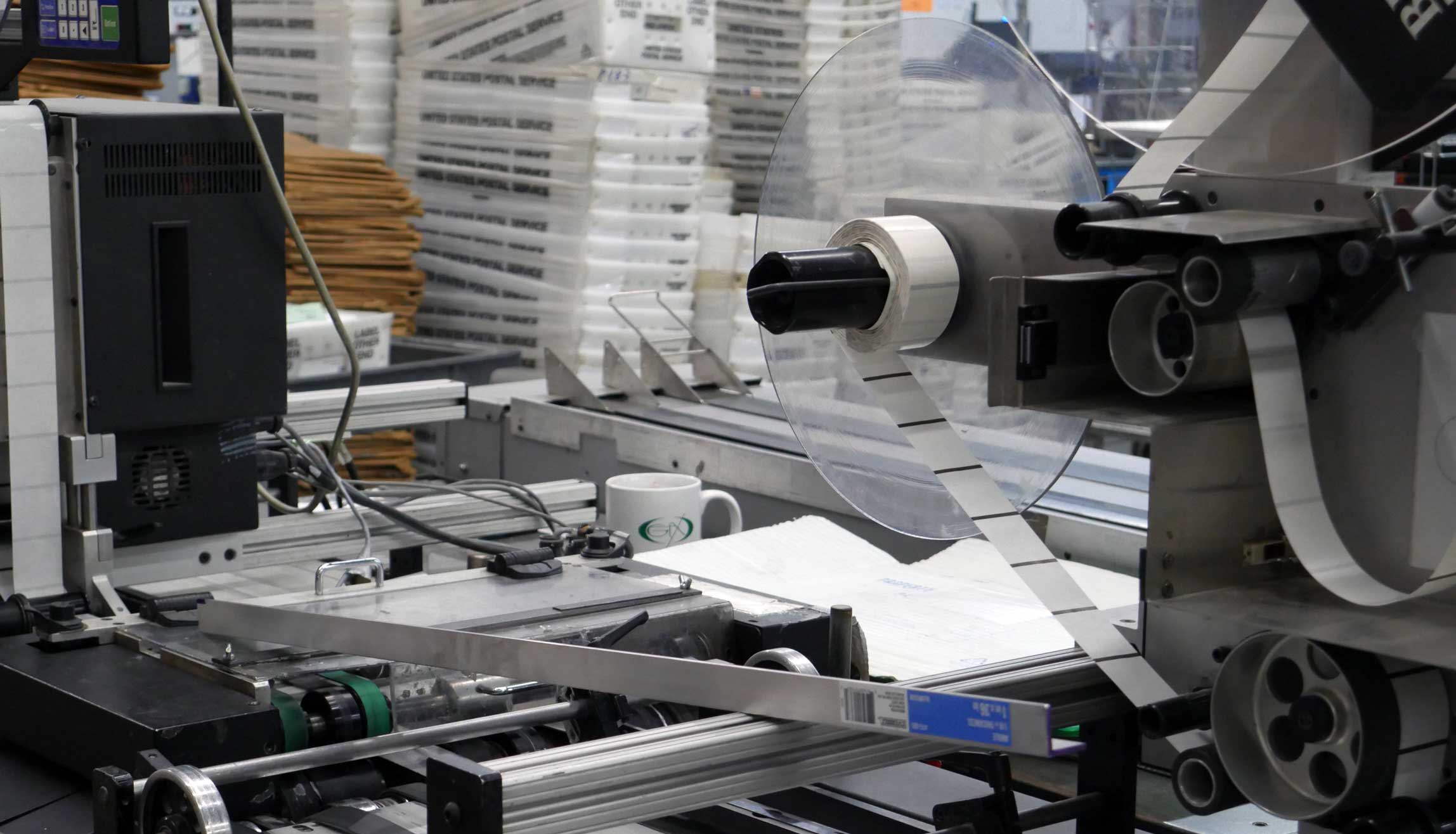 Closeup image of a machine used for tab sealing