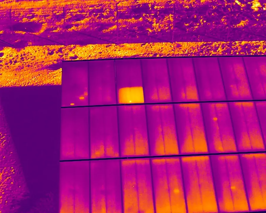 Thermal image: one module block hotter than its neighbors (candidate)
