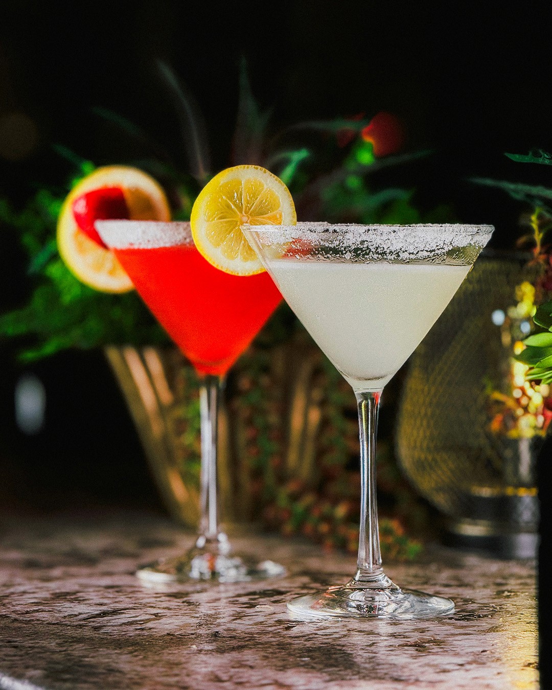 Surreal film poster featuring a director in a chair with a vintage camera for a head. Text: "James Cameron, the world greatest filmmaker." Green background.