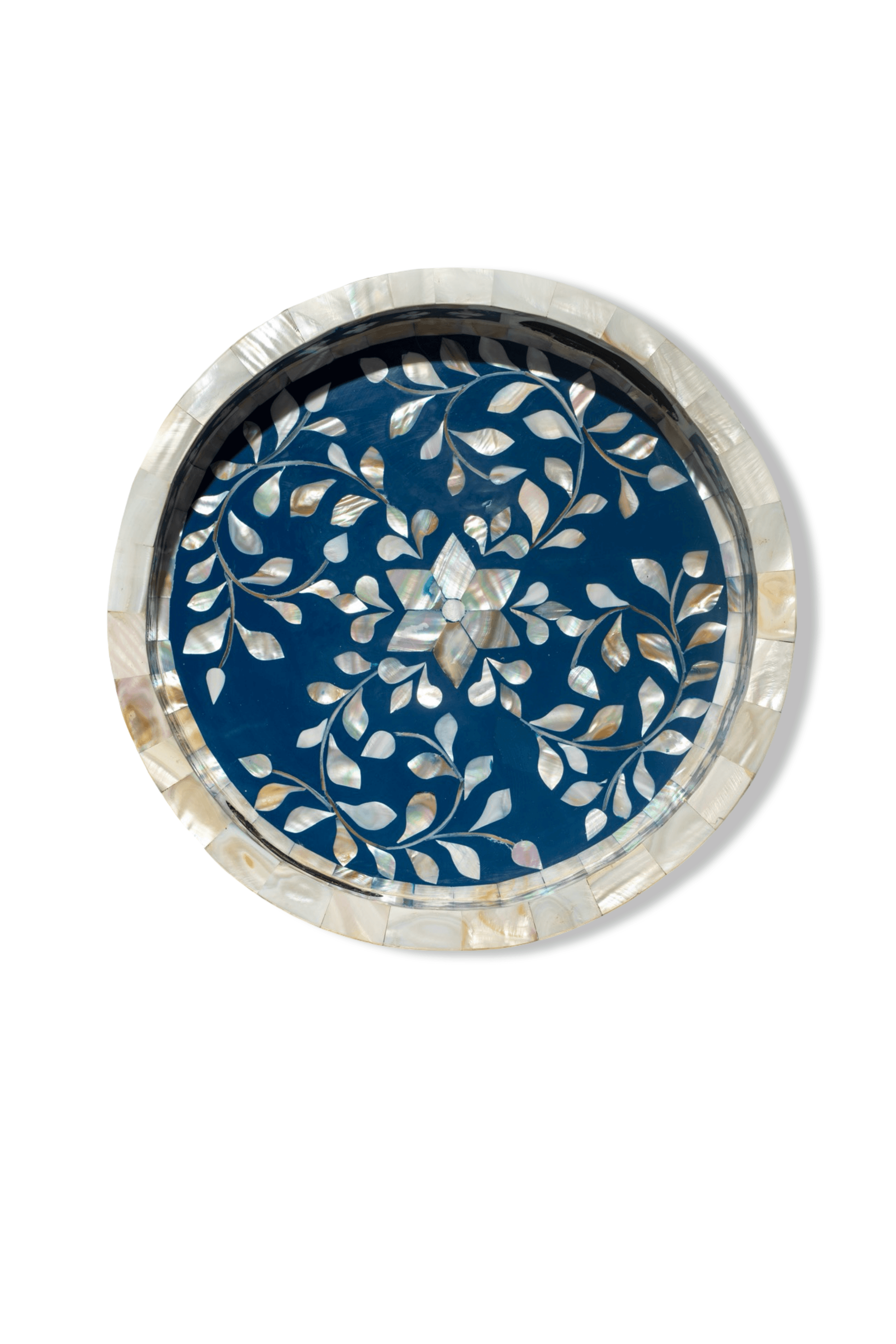Decorative round object with blue floral pattern on a white background