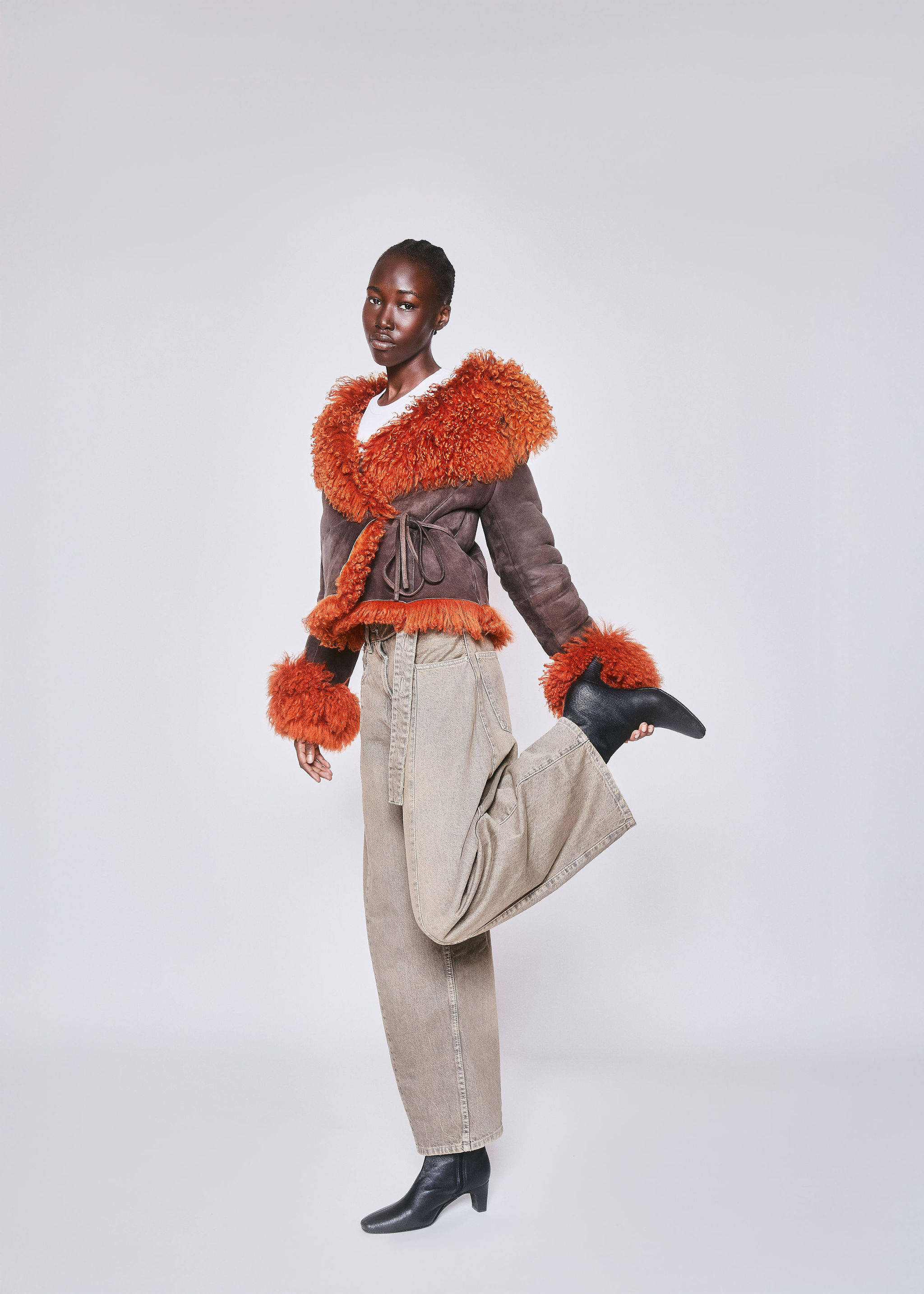 American flag flying against a cloudy sky