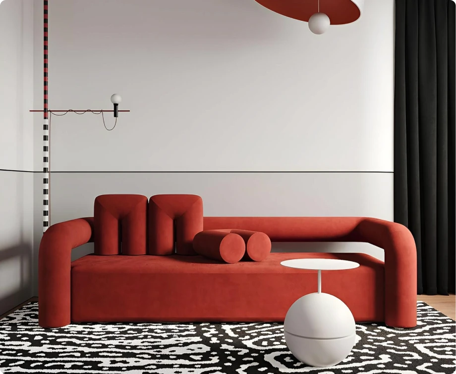 a living room with a red couch and a white lamp