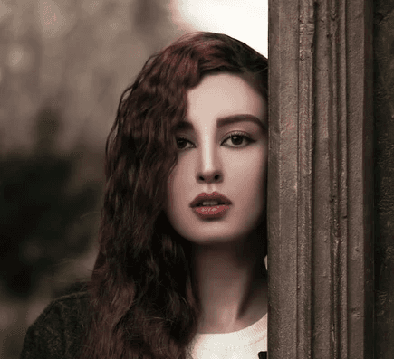 woman in white crew neck shirt and green cardigan