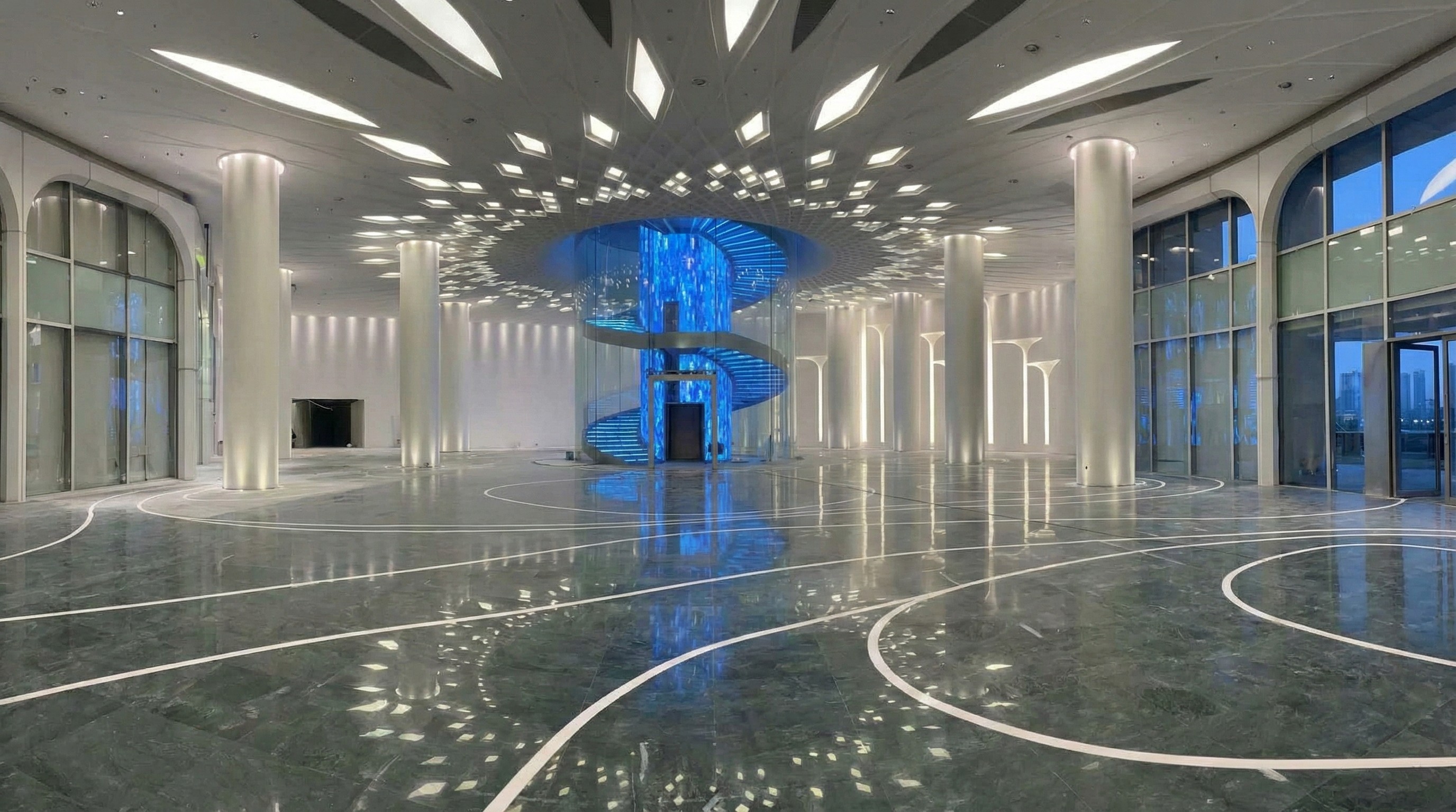 Grand subway station lobby with artistic marble floor inlays and glowing architectural stone columns by NOVA STONE.