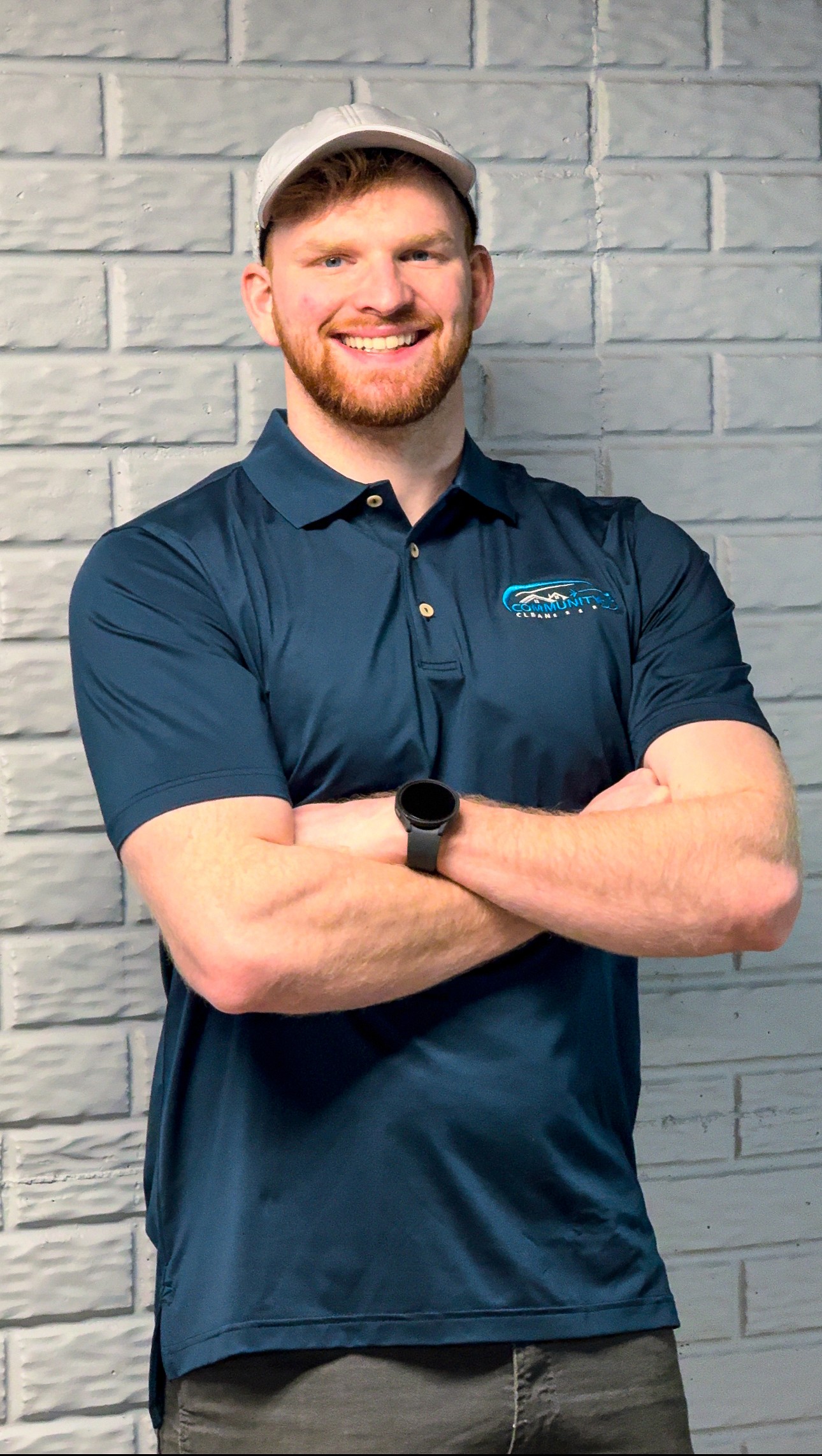 Community Clean team member in a branded polo shirt