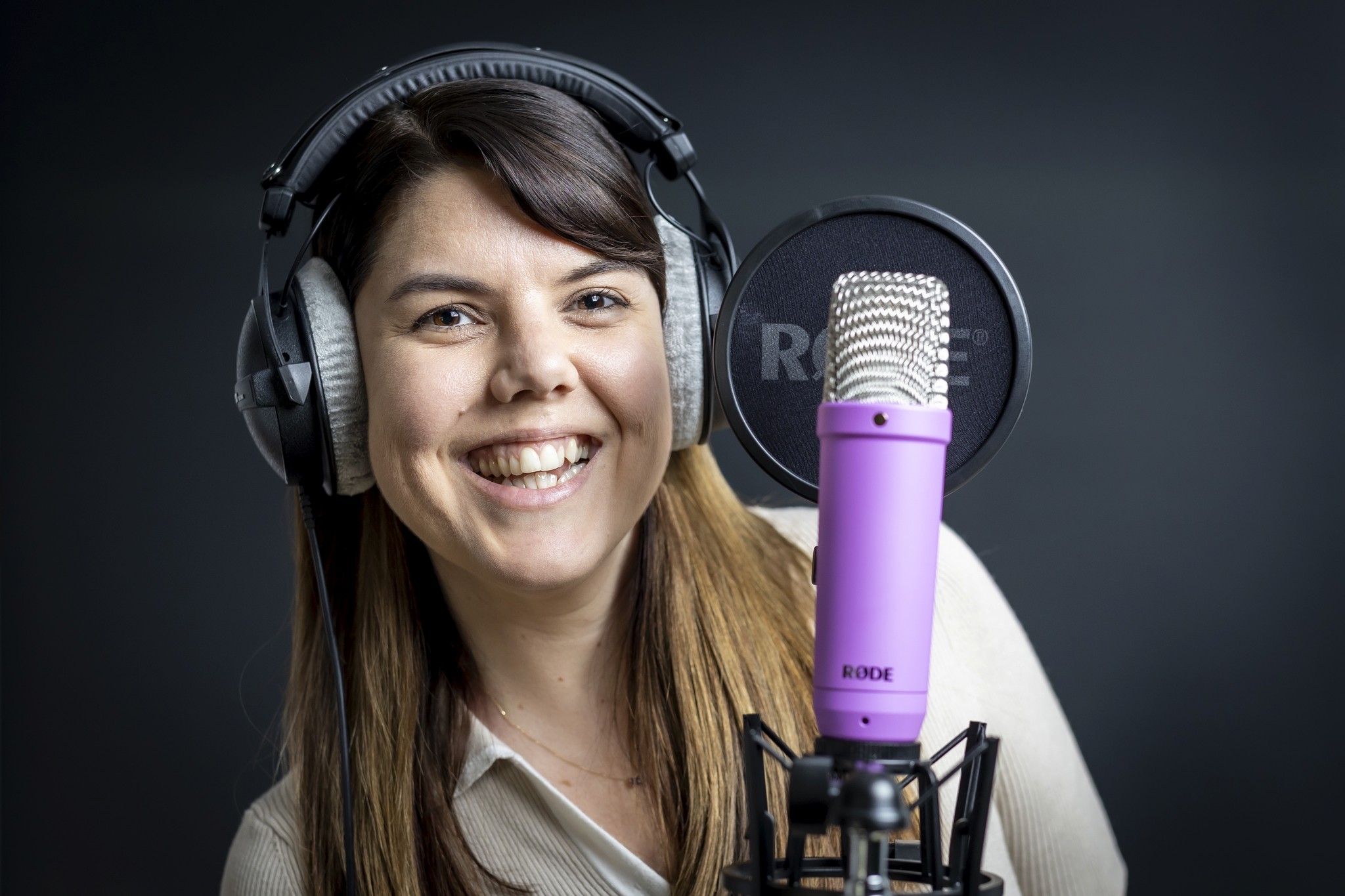 Photo of Kelsey Hall with voice acting equipment