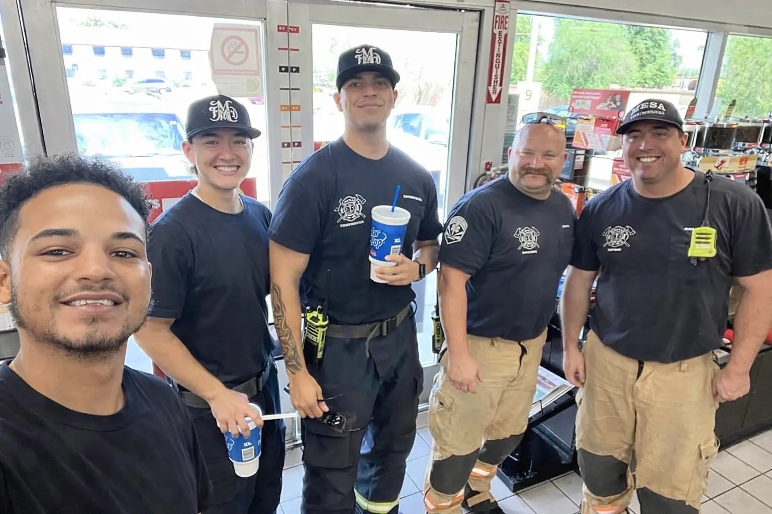 Selfie of Paul McGregor with 4 first responders in the community.