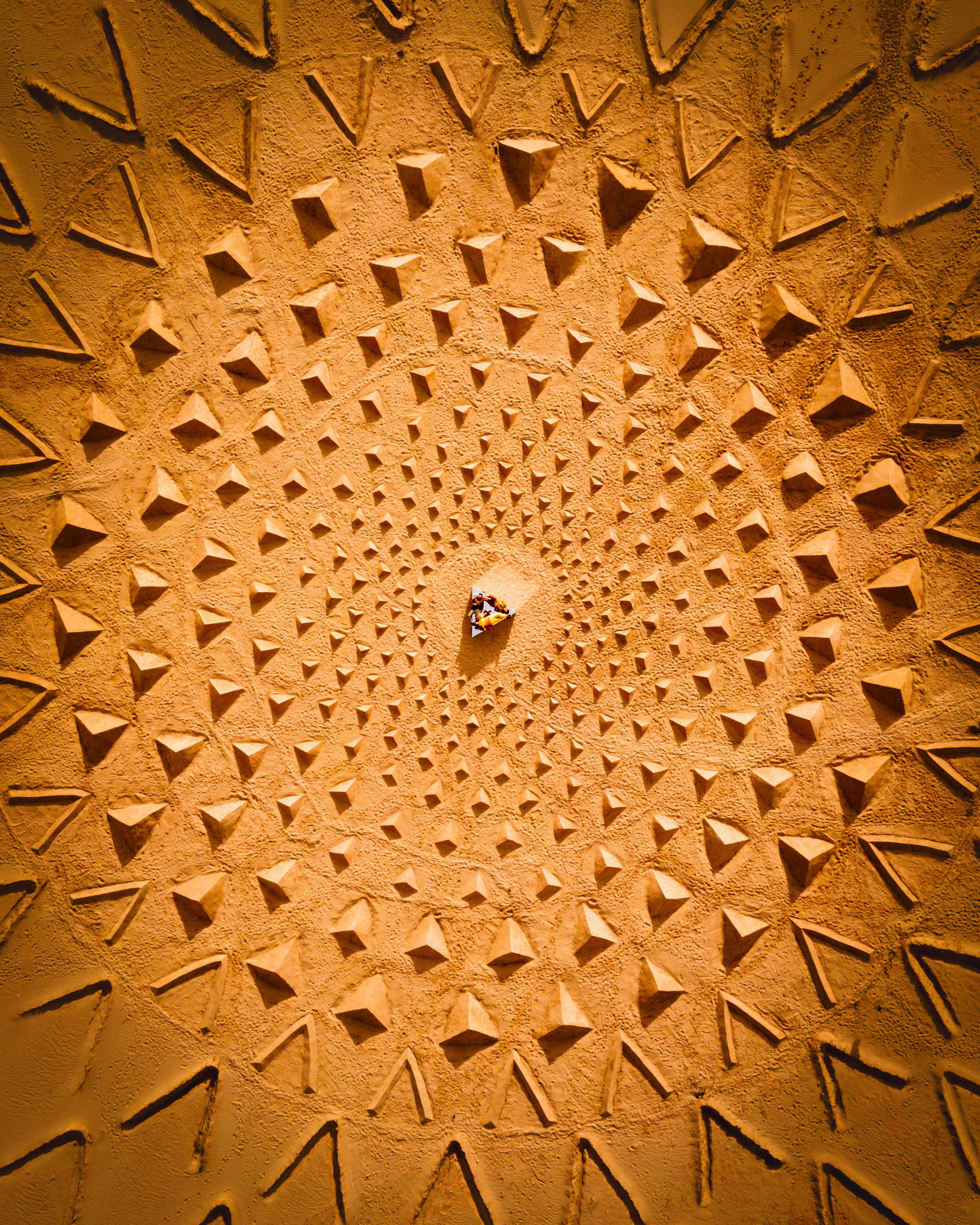 Land art created by Owen Brown and Jim Denevan featuring hundreds of pyramids made of sand