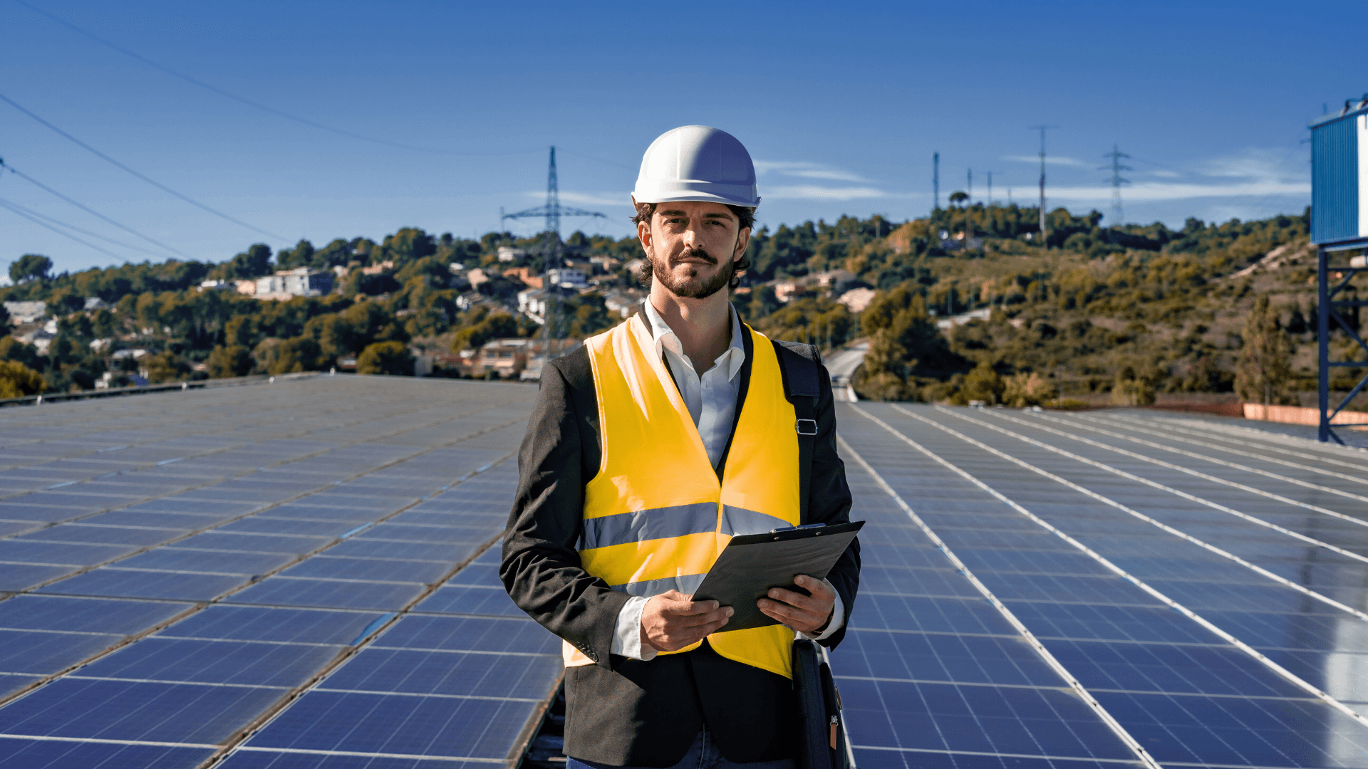 Neighborhood rooftops with solar panels and ‘Thank You Sunny Energy’ chalk art