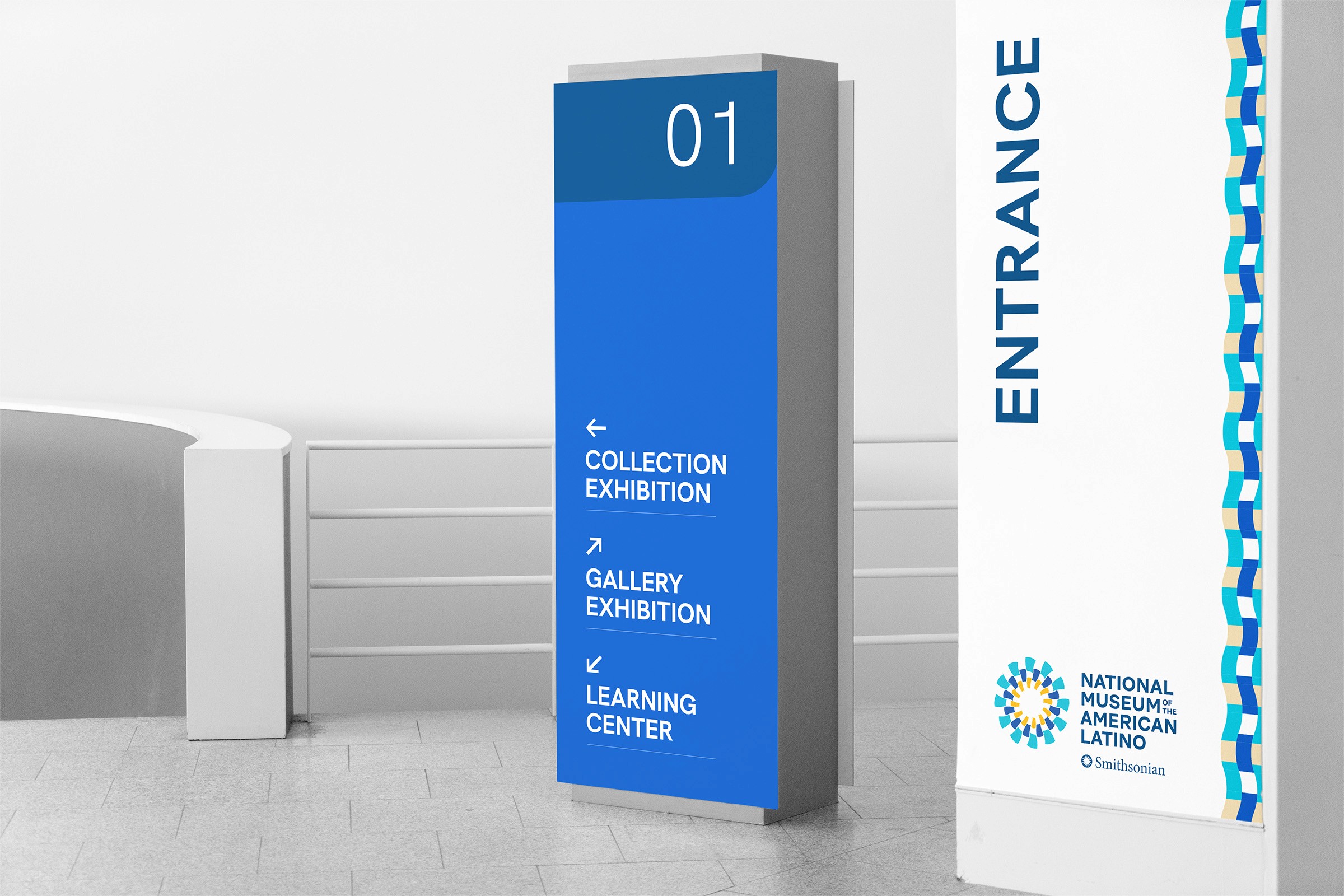 Presentation cards showcasing the new brand guidelines of the National Landing Research. The front is white with blue and yellow details, and the back is blue with the white logotype. 