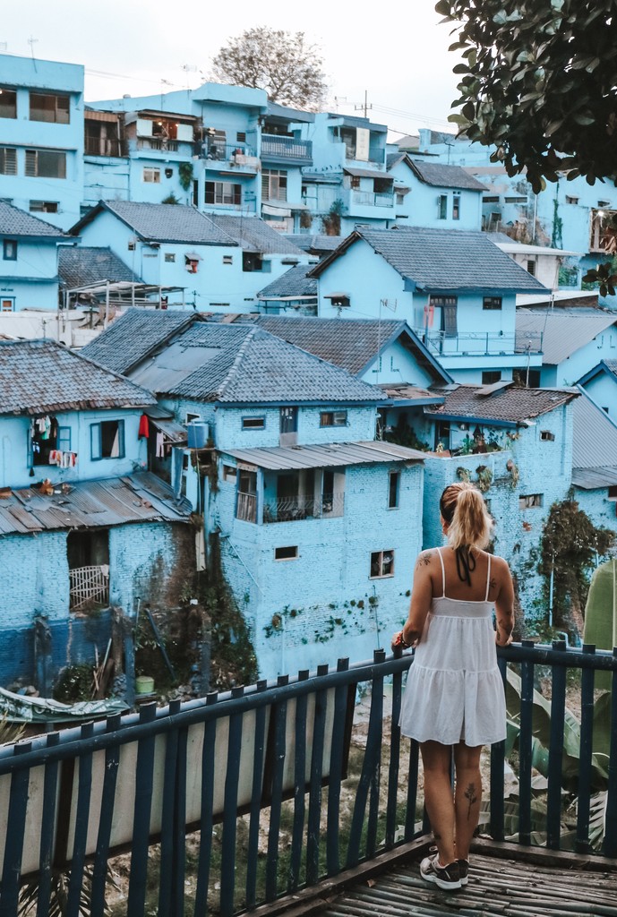 Girl next to clue houses