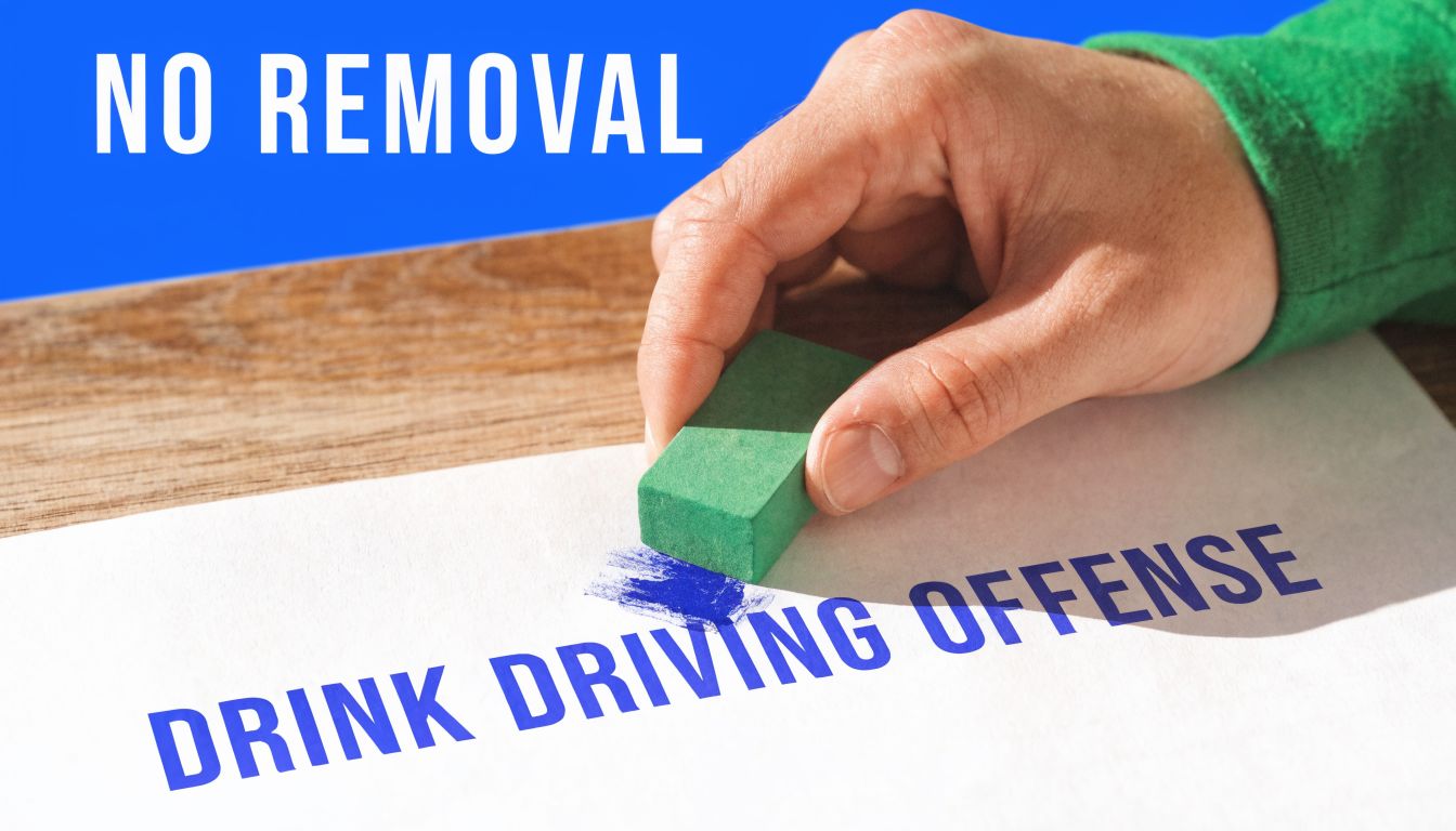 A hand uses a green eraser on a document that reads drink driving offense in blue ink.
