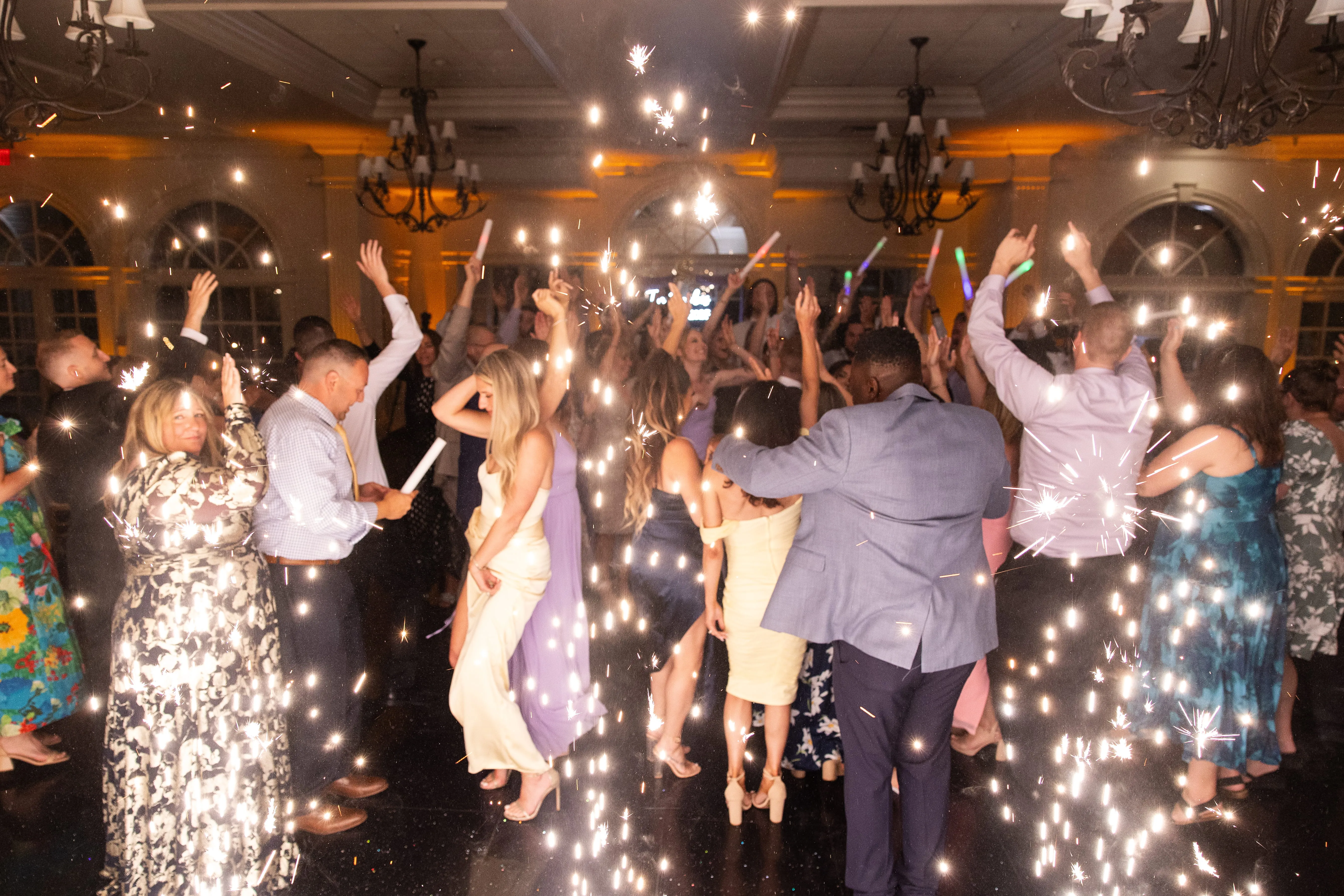 Wedding dance floor with cold spark effects and high energy crowd