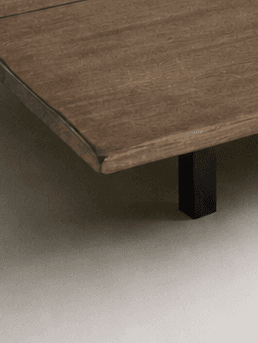 Close up of a minimalist wooden table in soft tones