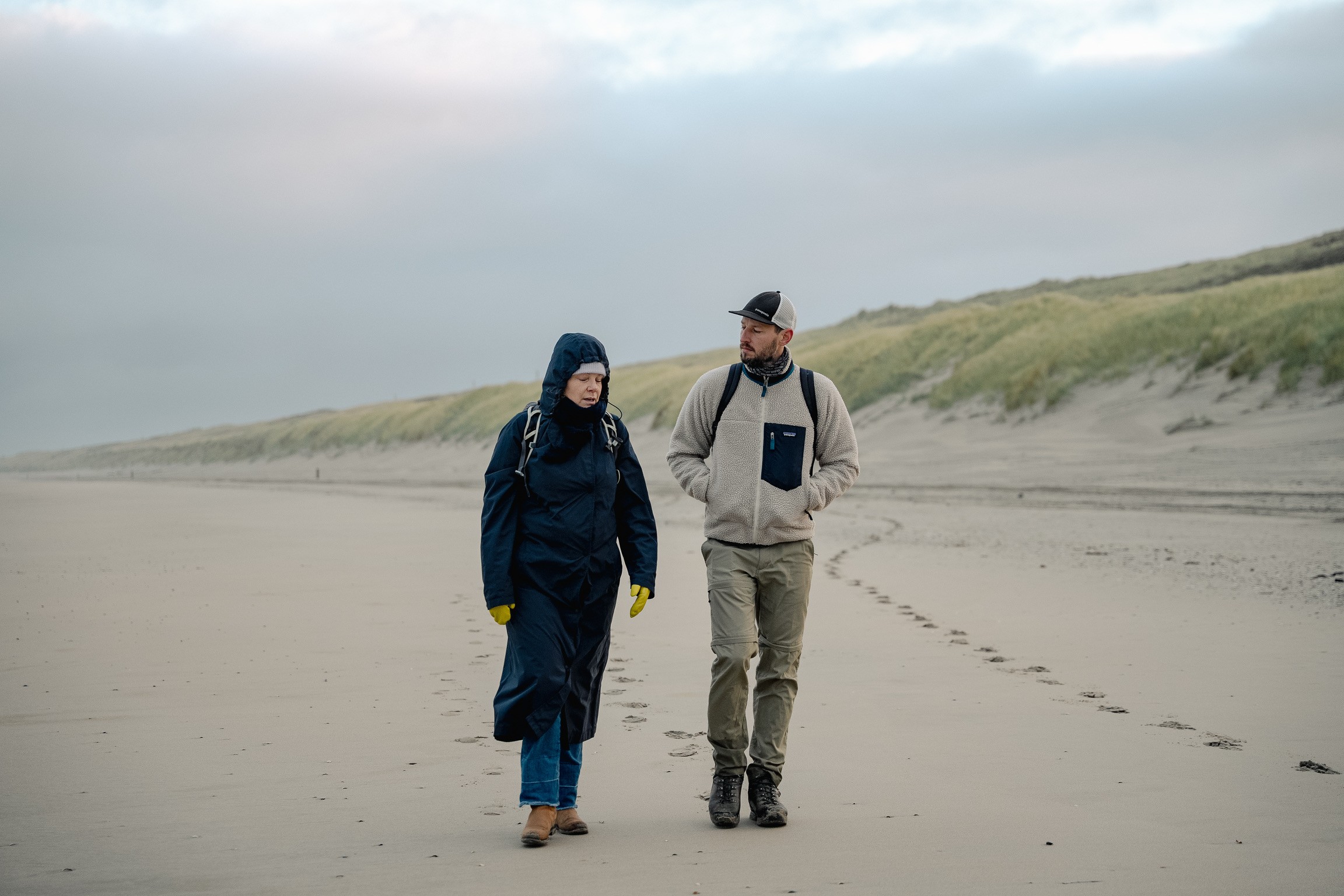 Two people walking and talking