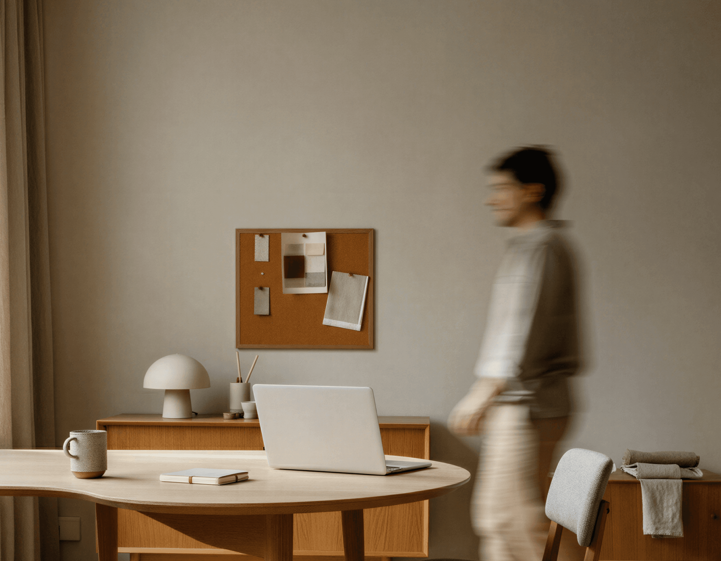 Person walking through a bright office