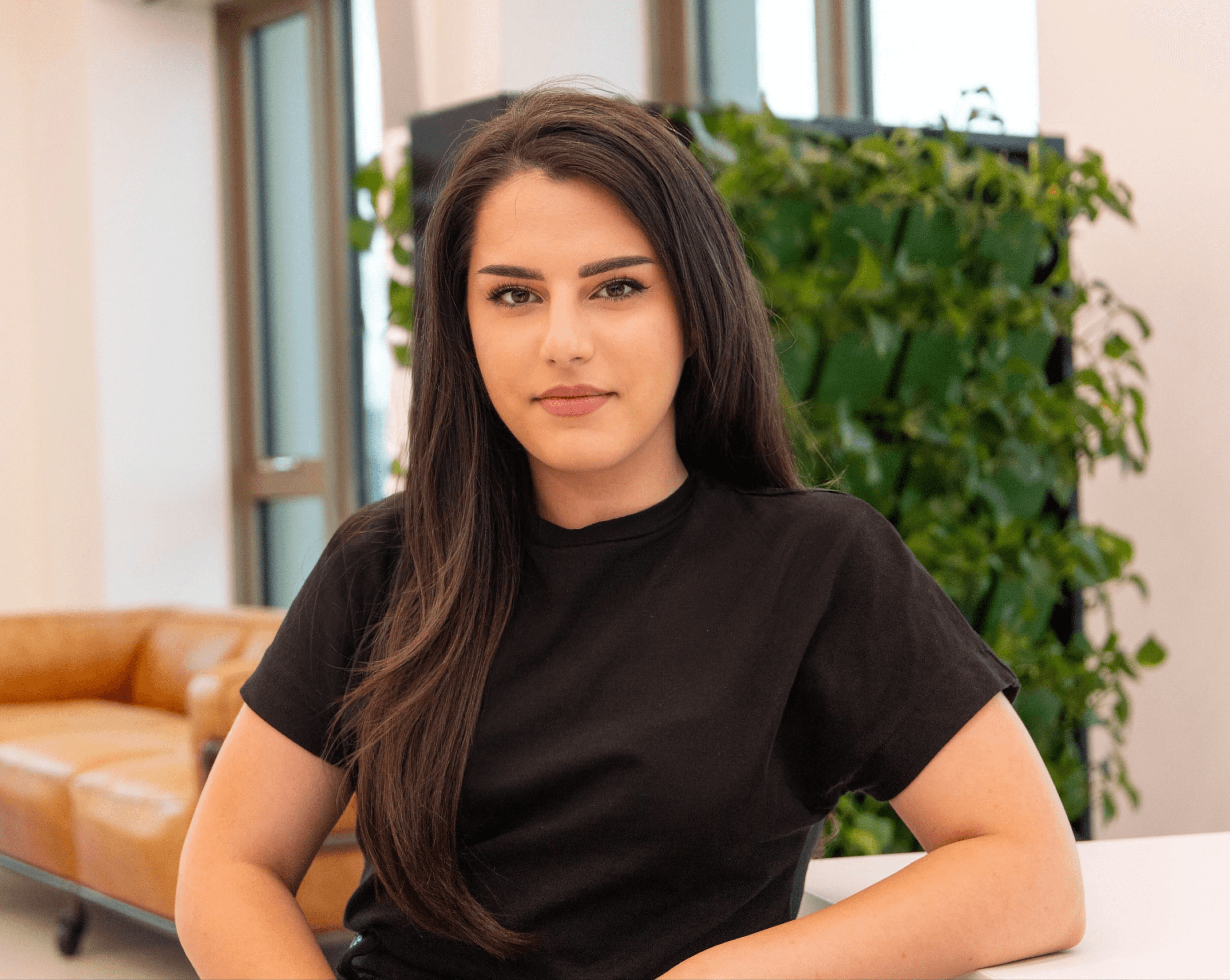 Side shot of a aman wearing a cap with the sun setting in the background