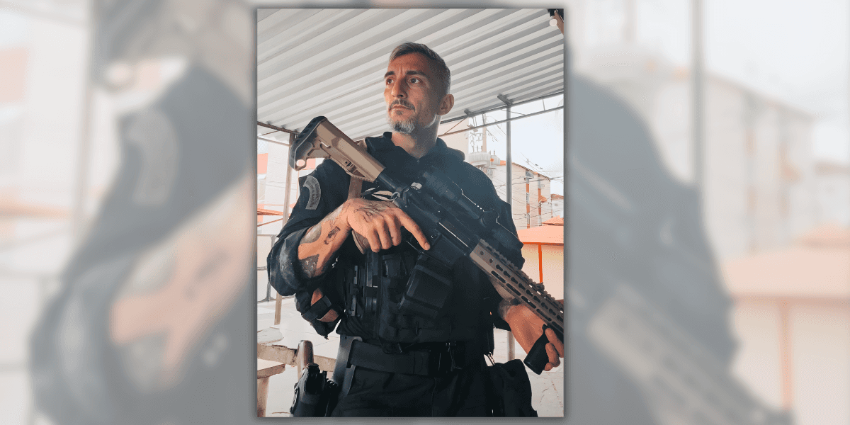 A tactical operator in full gear, holding a rifle, standing in an urban environment, embodying strength and defense expertise.