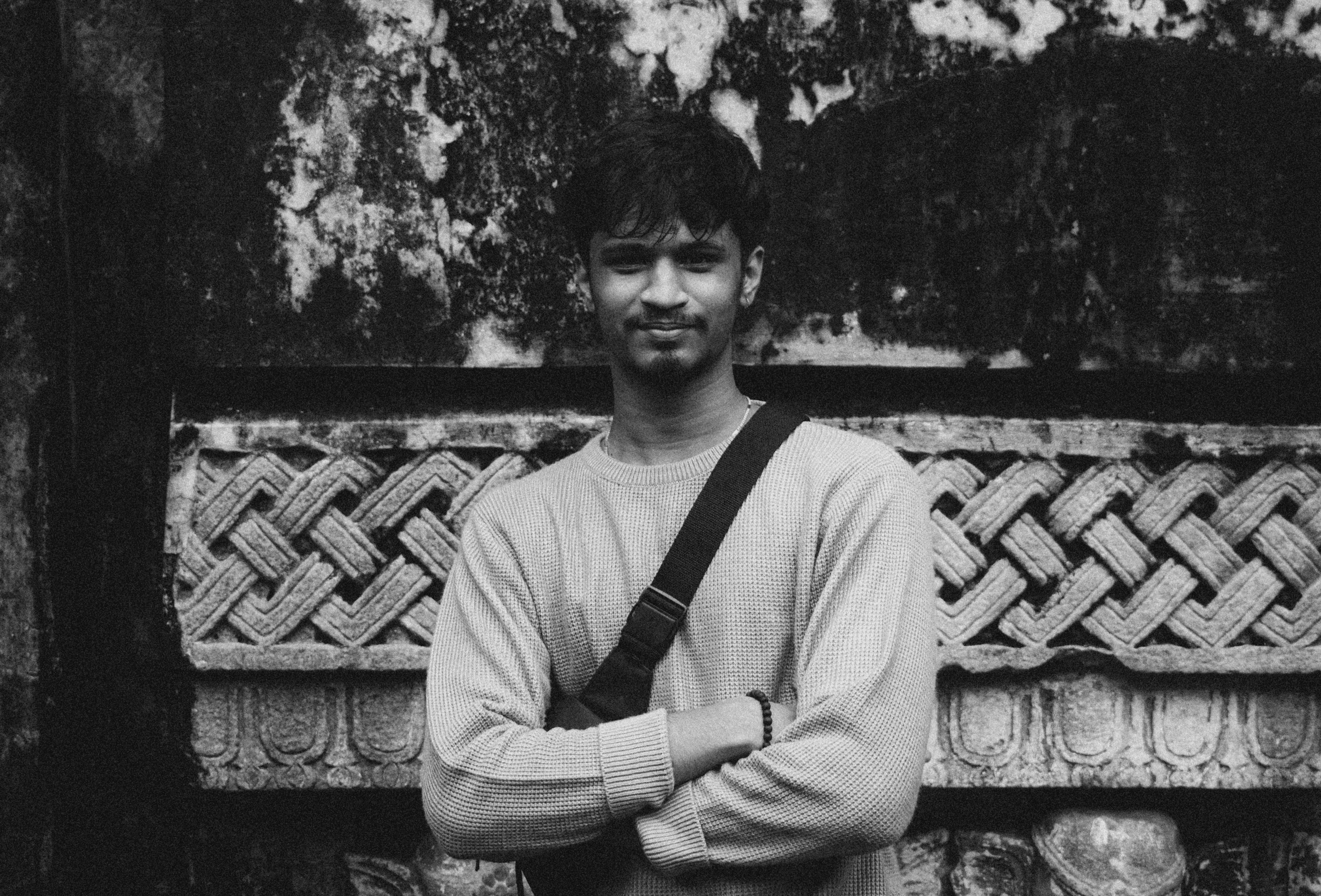 a blurry photo of a person standing in front of a wall