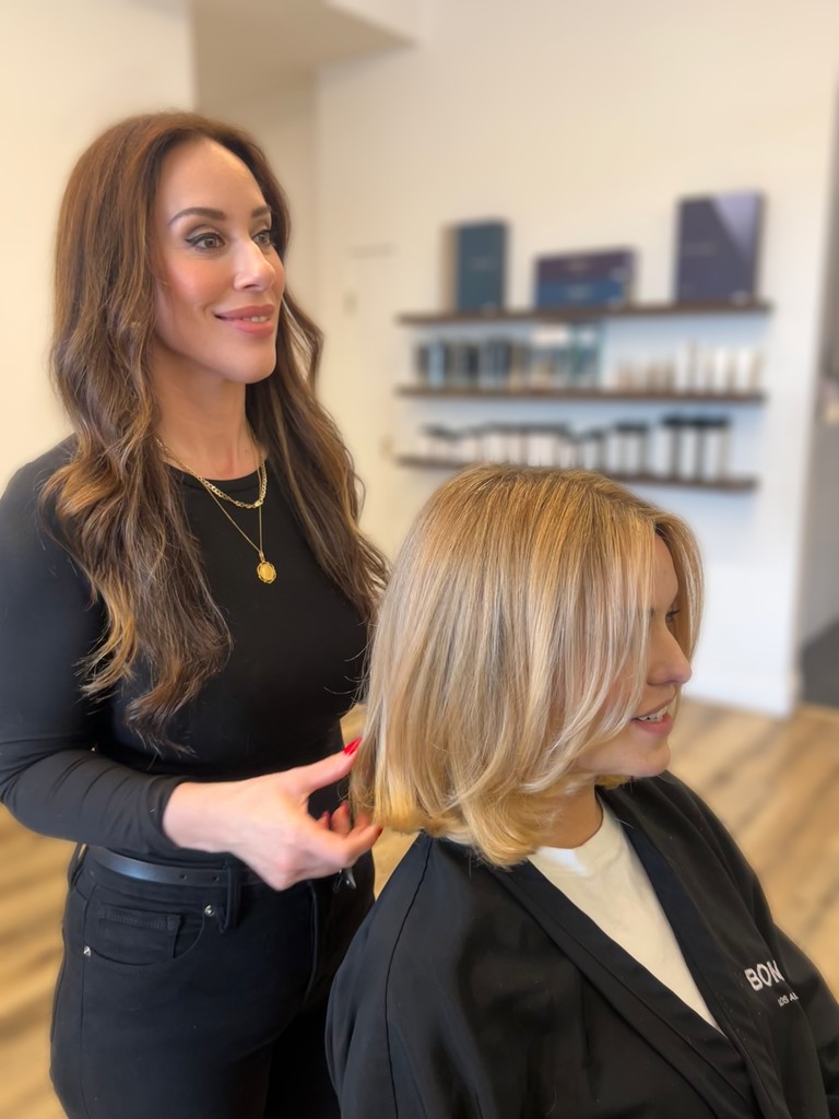 Jenn Montoya Palmore consulting with a client at Bomane Salon, Beverly Hills – expert hair color consultation.