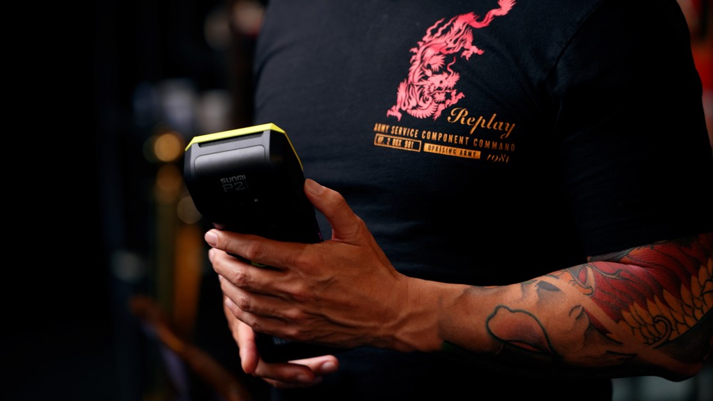 card machine in person's hand