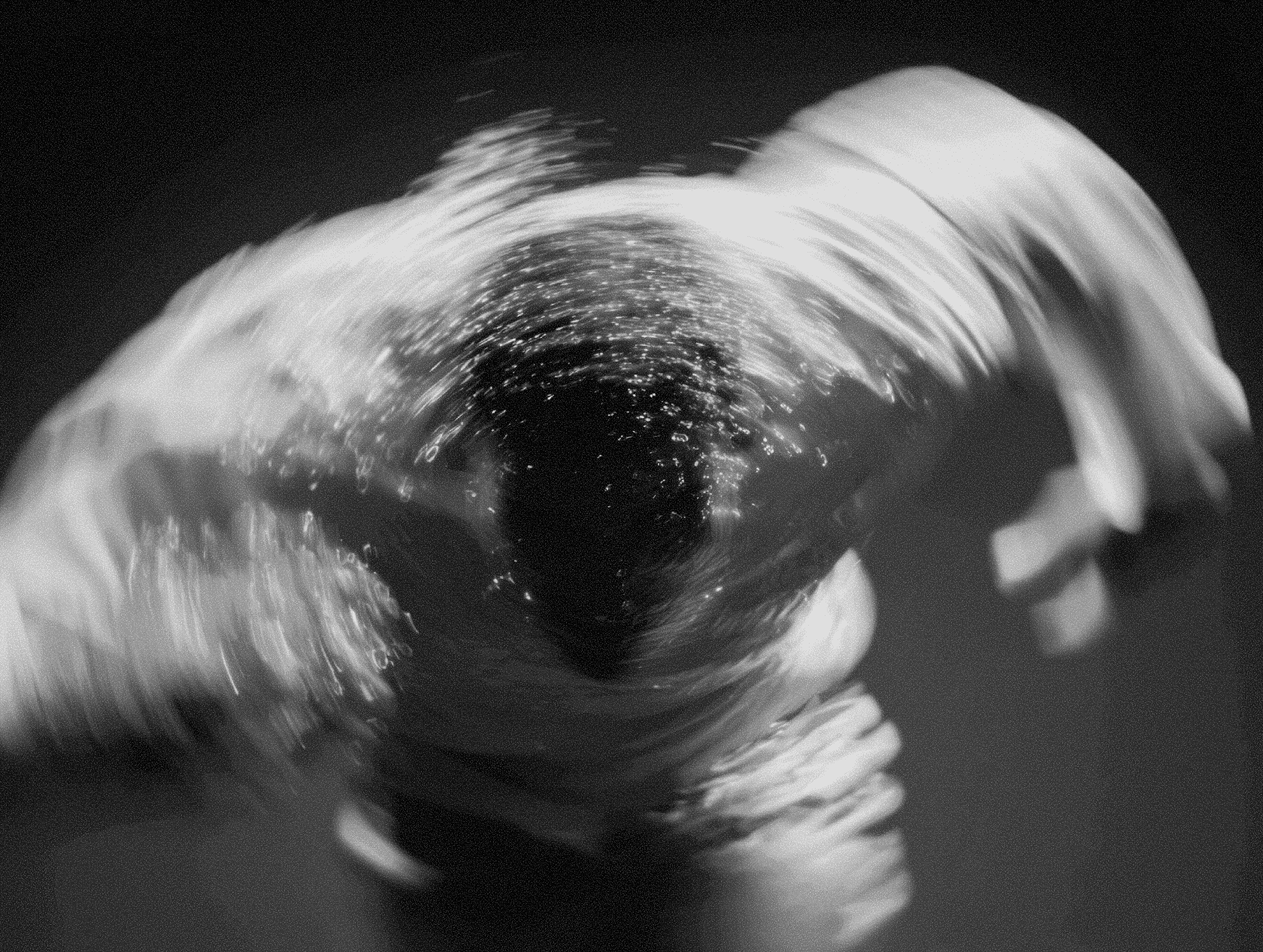 A swirling abstract portrait with strong motion distortion and textural blur