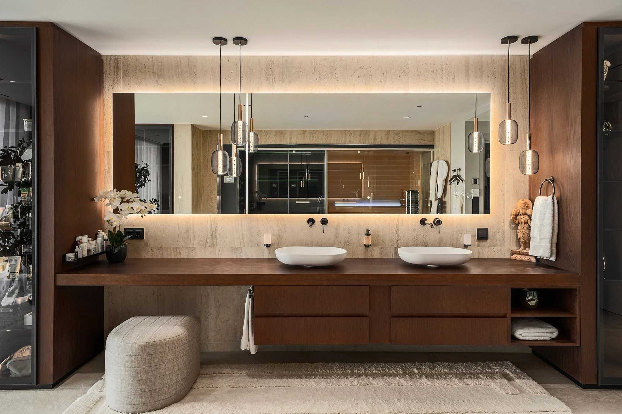 Villa Vista Marbella bathroom with double vanity, full-width mirror, and warm wood finishes