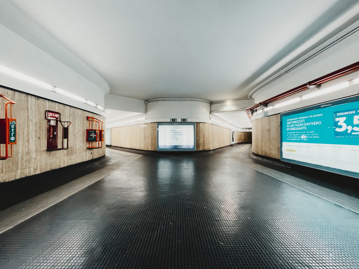 Empty Rome metro underground station platform with curved ceiling, part of the Rome transit network for getting around Italy