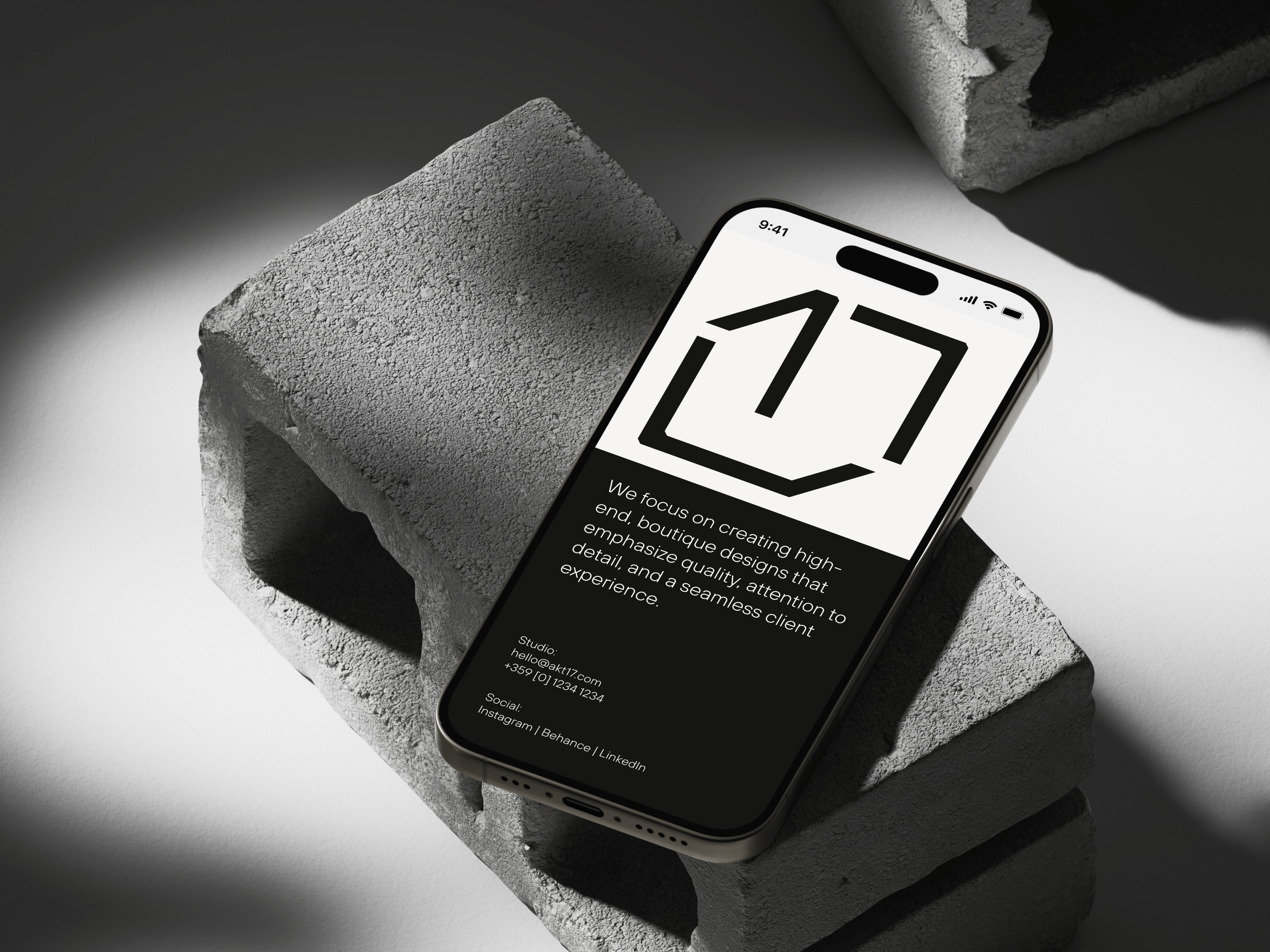 Akt17 brand identity displayed on iPhone mockup showing logo and brand messaging, Hival Design project