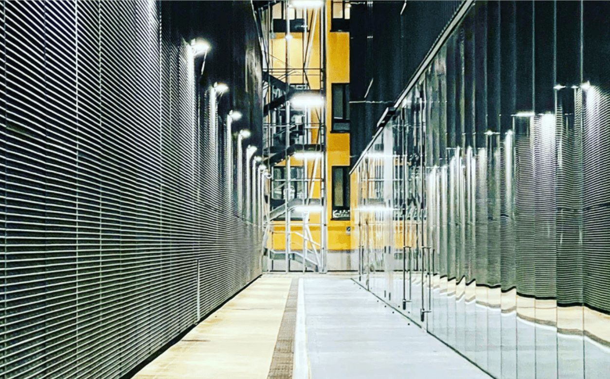 a row of blue and white lockers in a room